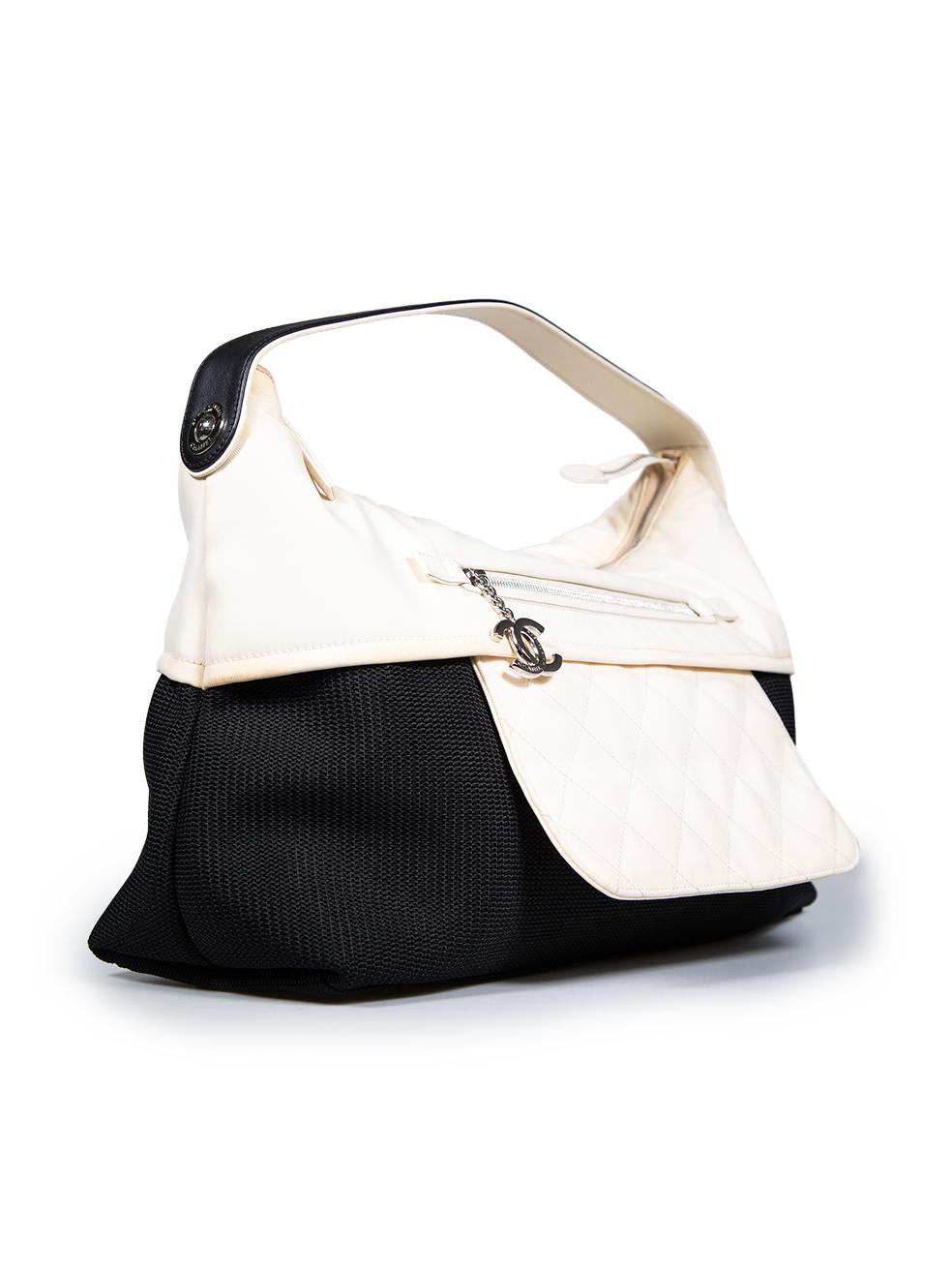 CONDITION is Very good. Minimal wear to bag is evident. Minimal discolouration to the white section of the bag, especially at the seams on the top near the zip, the middle seam, the top corner edges, the top handle and the zip puller. There is also
