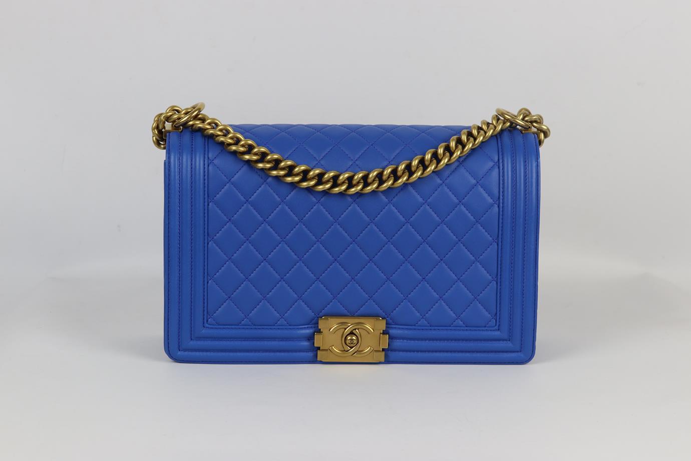 <ul>
<li>Chanel 2015 Boy large quilted leather shoulder bag.</li>
<li>Made from blue-tone quilted leather with matching leather interior and antiqued-gold hardware chain shoulder straps.</li>
<li>Blue.</li>
<li>Push lock fastening at
