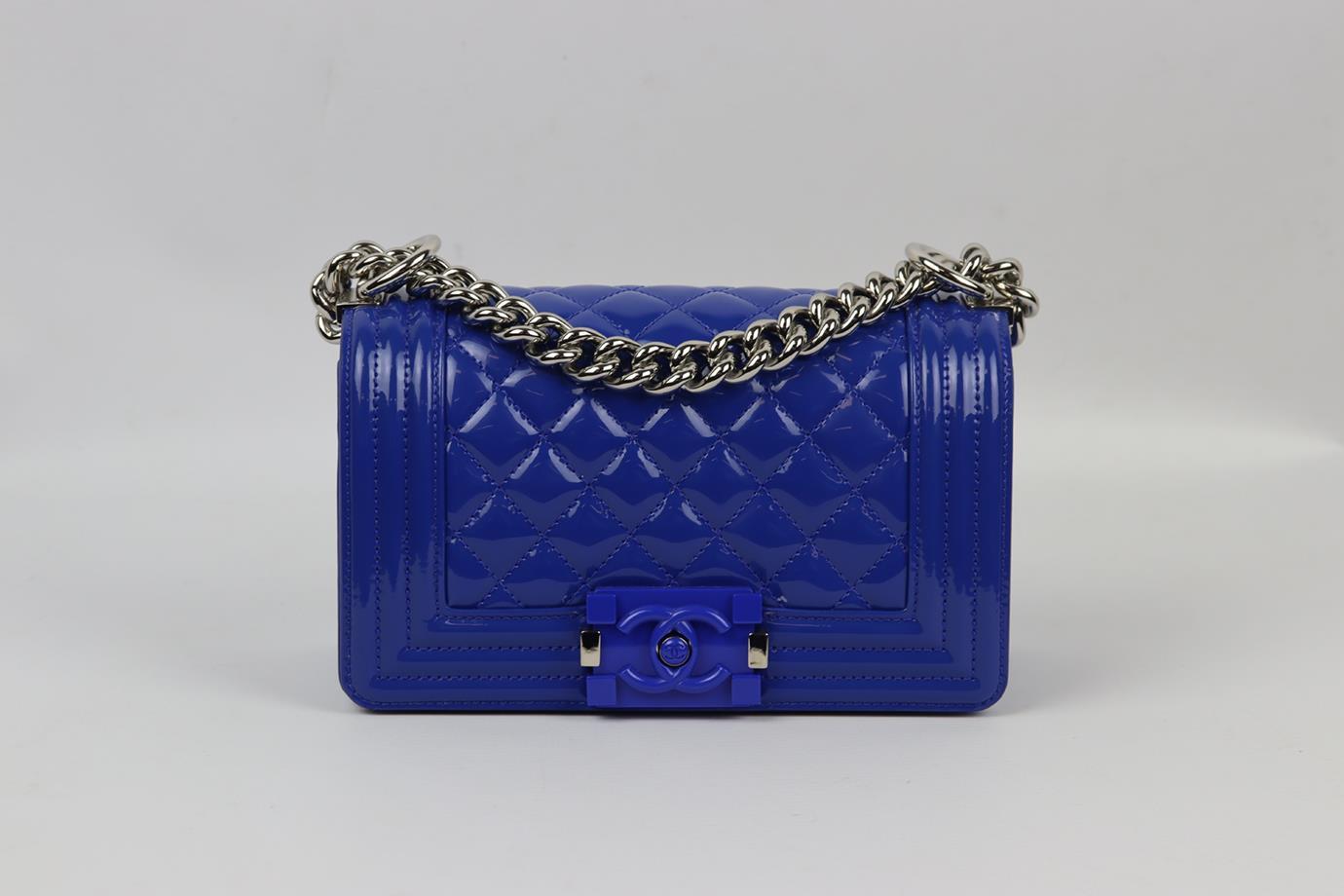 Chanel 2015 Boy small quilted patent leather shoulder bag. Made from bright-blue quilted patent-leather with matching leather interior and palladium chain shoulder straps. Blue. Push lock fastening at front. Comes with authenticity card. Protective