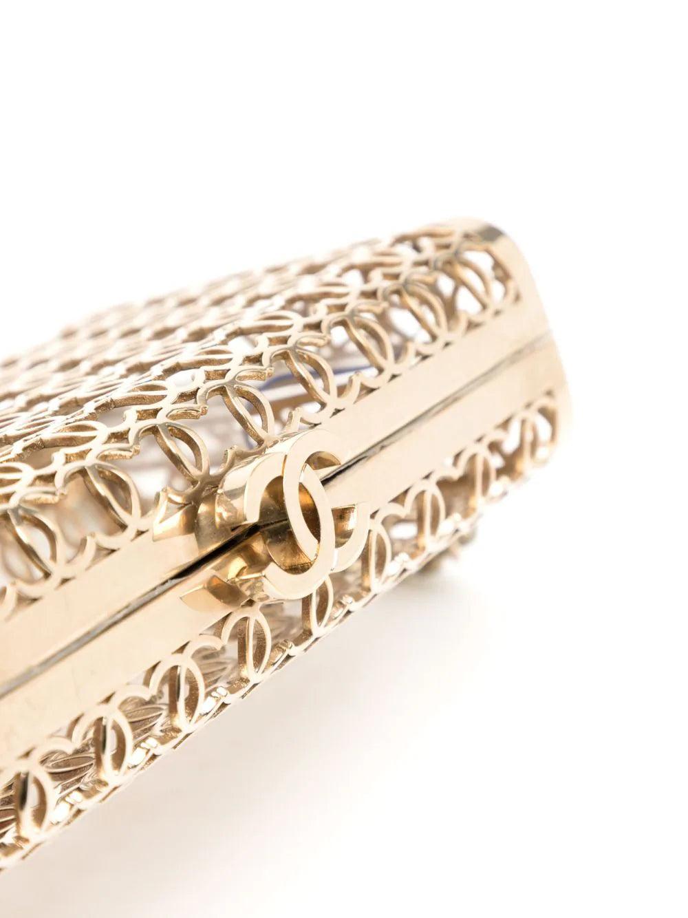 Chanel Mini Hand Bag Gold

This rare Paris-Dubai Runway Champagne CC Minaudiere is one of the pieces featured on the runway of Chanel Cruise 2015.

The collection evoked Middle-Eastern folk stories Arabian Nights and Aladdin with the use of patterns