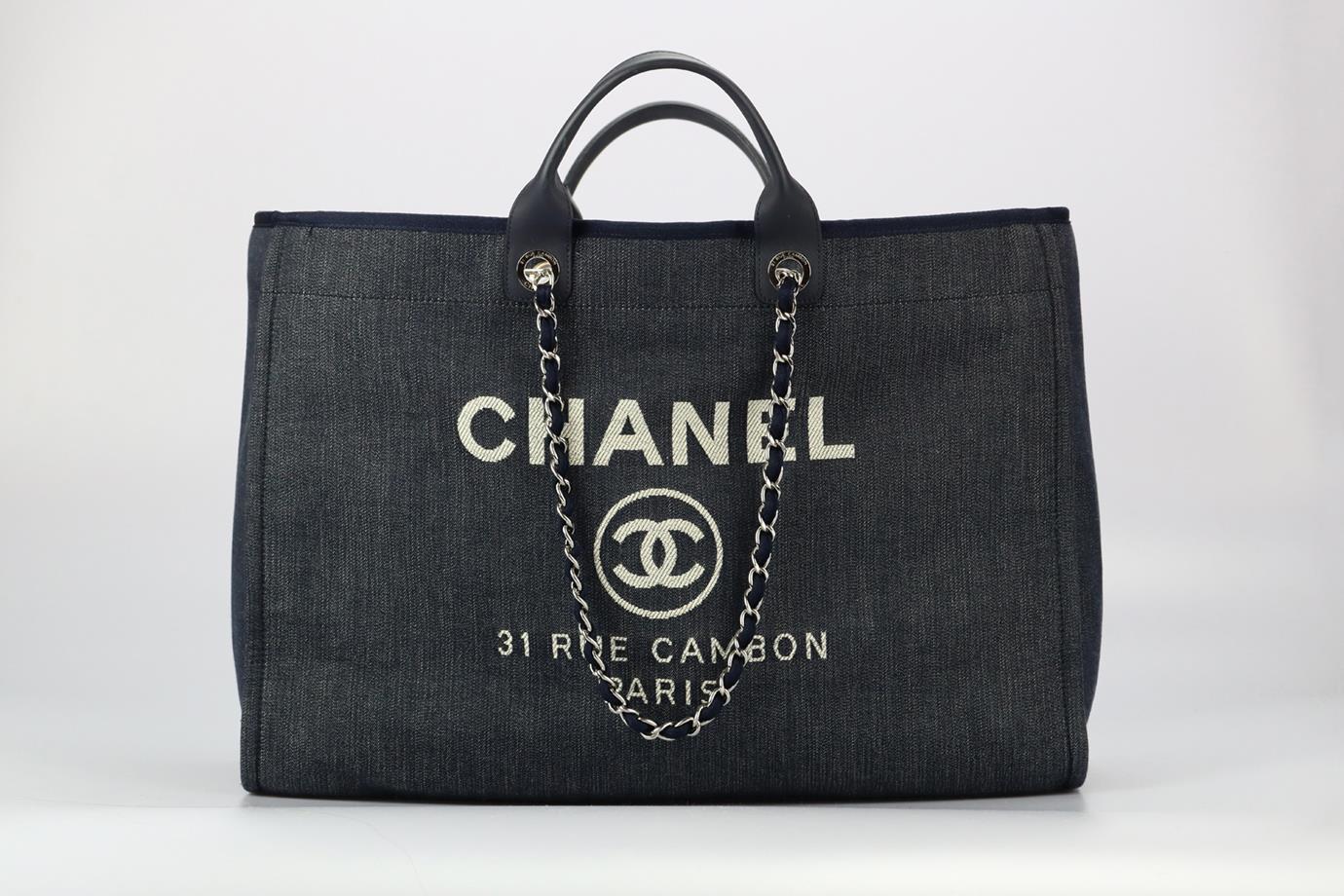 Chanel 2015 Deauville Extra Large Canvas And Leather Tote Bag. Navy. Clasp fastening - Interior. Comes with - authenticity card. Does not come with - dustbag or box. Height: 14.2 in. Width: 19.6 in. Depth: 9.2 in. Handle drop: 3.8 in. Strap drop: