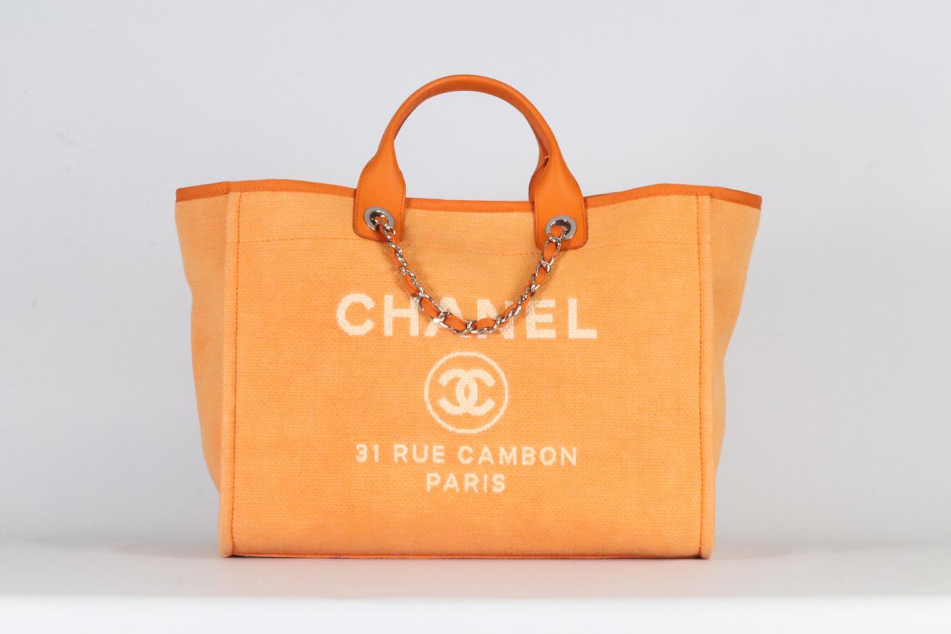 <ul>
<li>Chanel 2015 Deauville Medium Canvas And Leather Tote Bag.</li>
<li>Orange.</li>
<li>Magnetic fastening - Top.</li>
<li>Comes with Authenticity Card.</li>
<li>Does not come with - dustbag or box.</li>
<li><strong>Model: