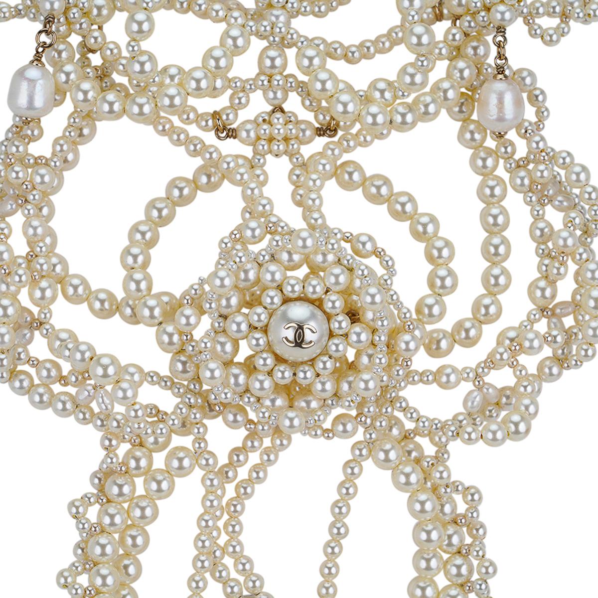 Mightychic offers a very rare Chanel 2105A limited edition fresh water pearl necklace.
Necklace has cascading entwined pearls with a center Camelia and CC pearl.
Unmistakably Chanel.
This fabulous bib style Chanel necklace is a show stopping