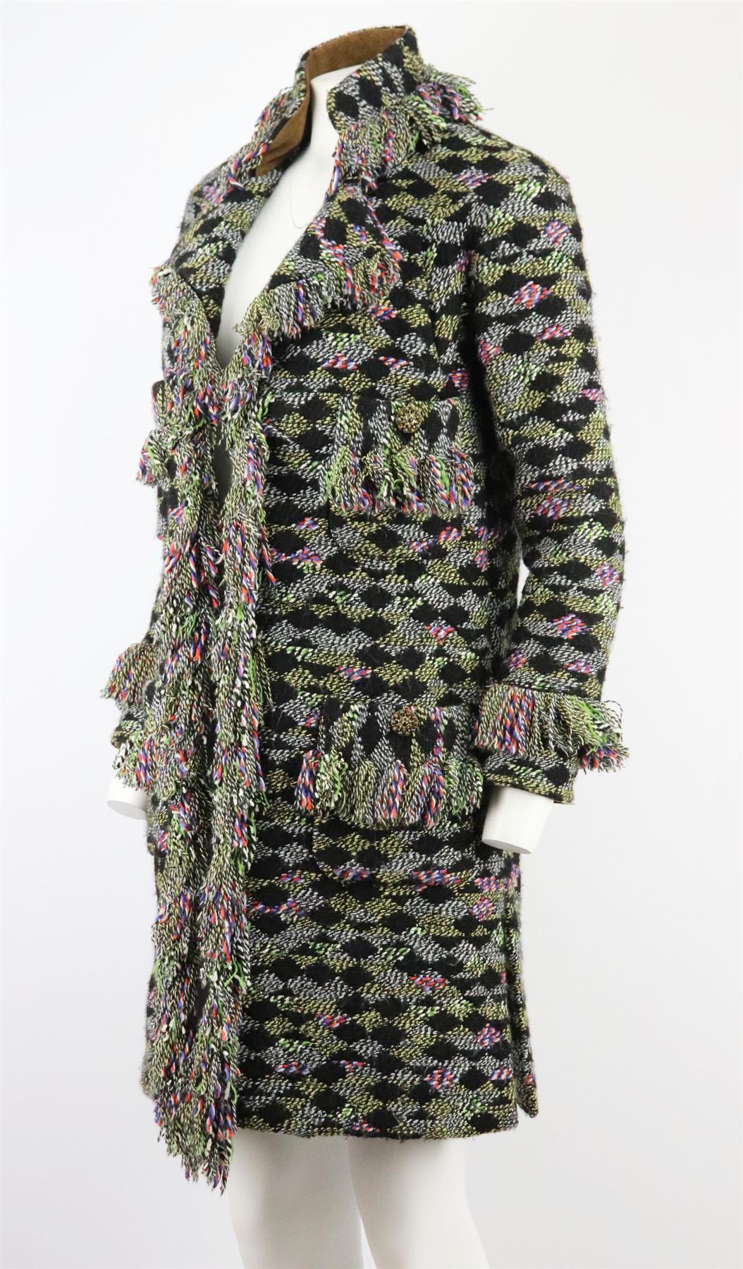 This coat by Chanel from the Paris-Salzburg 2015 catwalk is an elevated essentials piece for your wardrobe; this coat is cut from beautifully rich wool-blend Fantasy tweed and finished with fringing detail along the cuffs, hem and neckline.