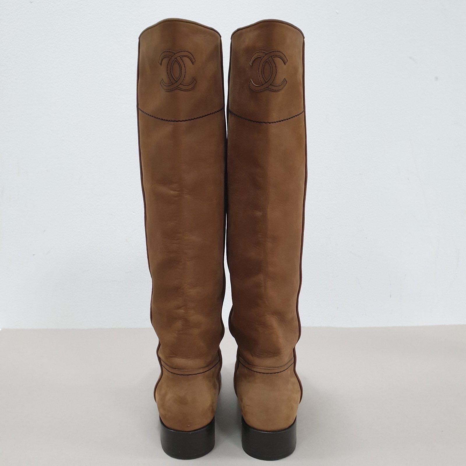  Chanel 2015 Interlocking CC Logo Riding Boots. 
With their timeless design and iconic logo, these boots are a statement of your impeccable taste and a versatile addition to your wardrobe. 
Experience the luxury, sophistication, and enduring appeal