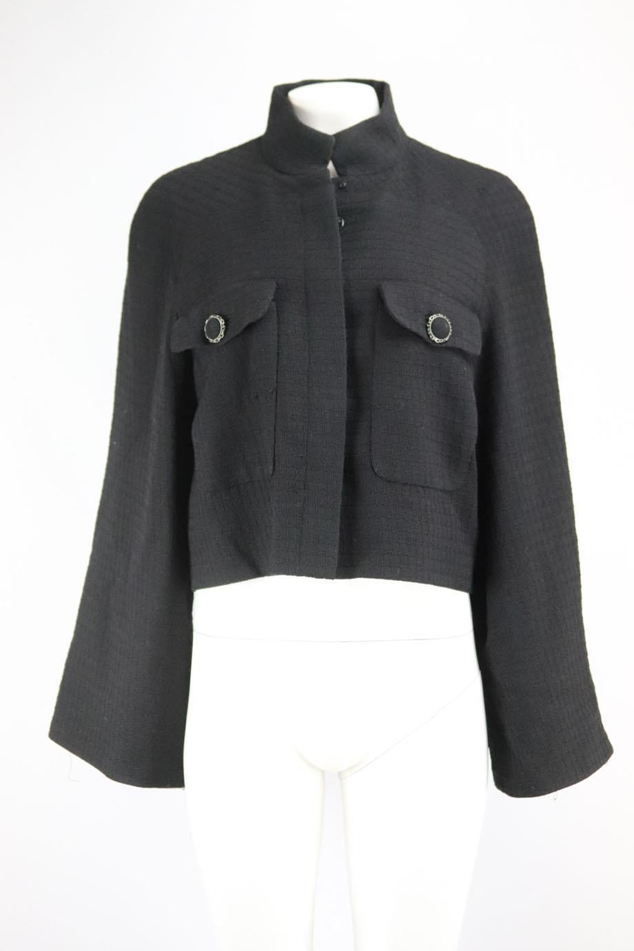 Chanel 2015 wool blend tweed jacket. Black. Long sleeve, v-neck. Button fastening at front. 100% Wool; lining: 100% silk. Size: FR 44 (UK 16, US 12, IT 48). Shoulder to shoulder: 16.5 in. Bust: 47 in. Waist: 47 in. Hips: 47 in. Length: 21.5 in. Very