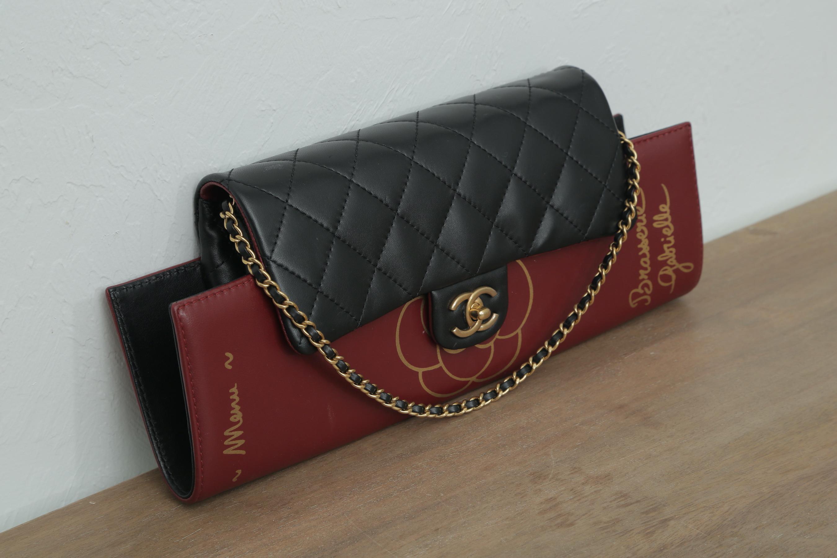 Burgundy lambskin and quilted diamond stitch Chanel Menu clutch flap

Year: 2015
Gold hardware
Classic interlocking cc clasp
Interior large pocket
Two additional interior pockets
Interwoven chain
Can be worn as flap or clutch
6.5” H x 15” W x 2”
