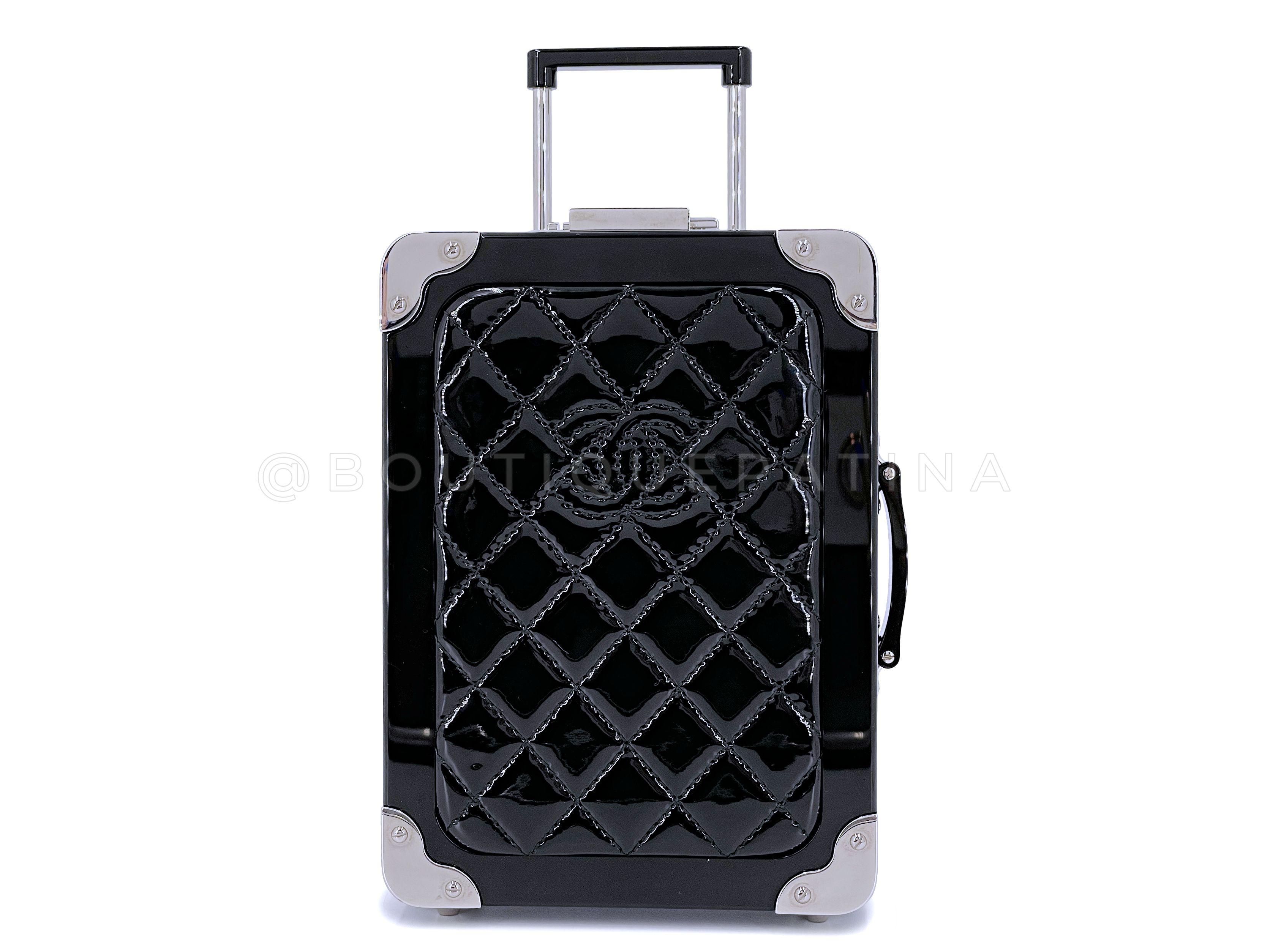 Store item: 67163
Chanel 2016 Airlines Evening In The Air Trolley Minaudière Clutch Bag Black Patent
From Lagerfeld's 2016 Spring Airlines collection, with black leather interior, working telescopic handle and stainless steel feet and wheels. 

In