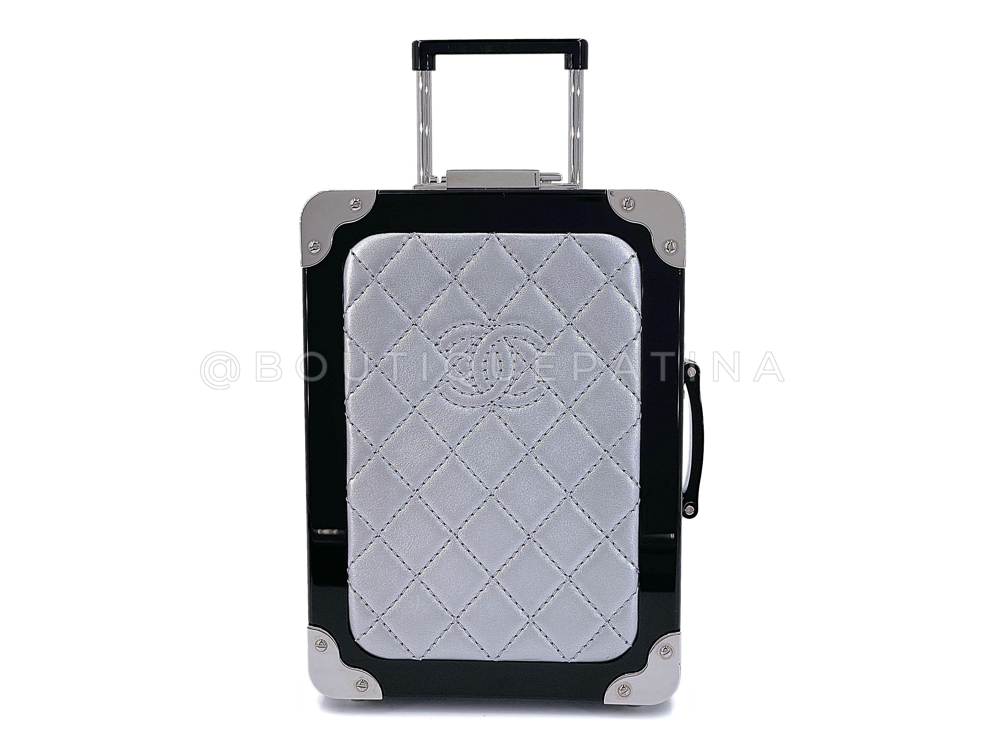 Store item: 67681
Chanel 2016 Airlines Evening In The Air Trolley Minaudière Clutch Bag Gray Silver

From Lagerfeld's 2016 Spring Airlines collection, with black leather interior, working telescopic handle and stainless steel feet and wheels. 

In