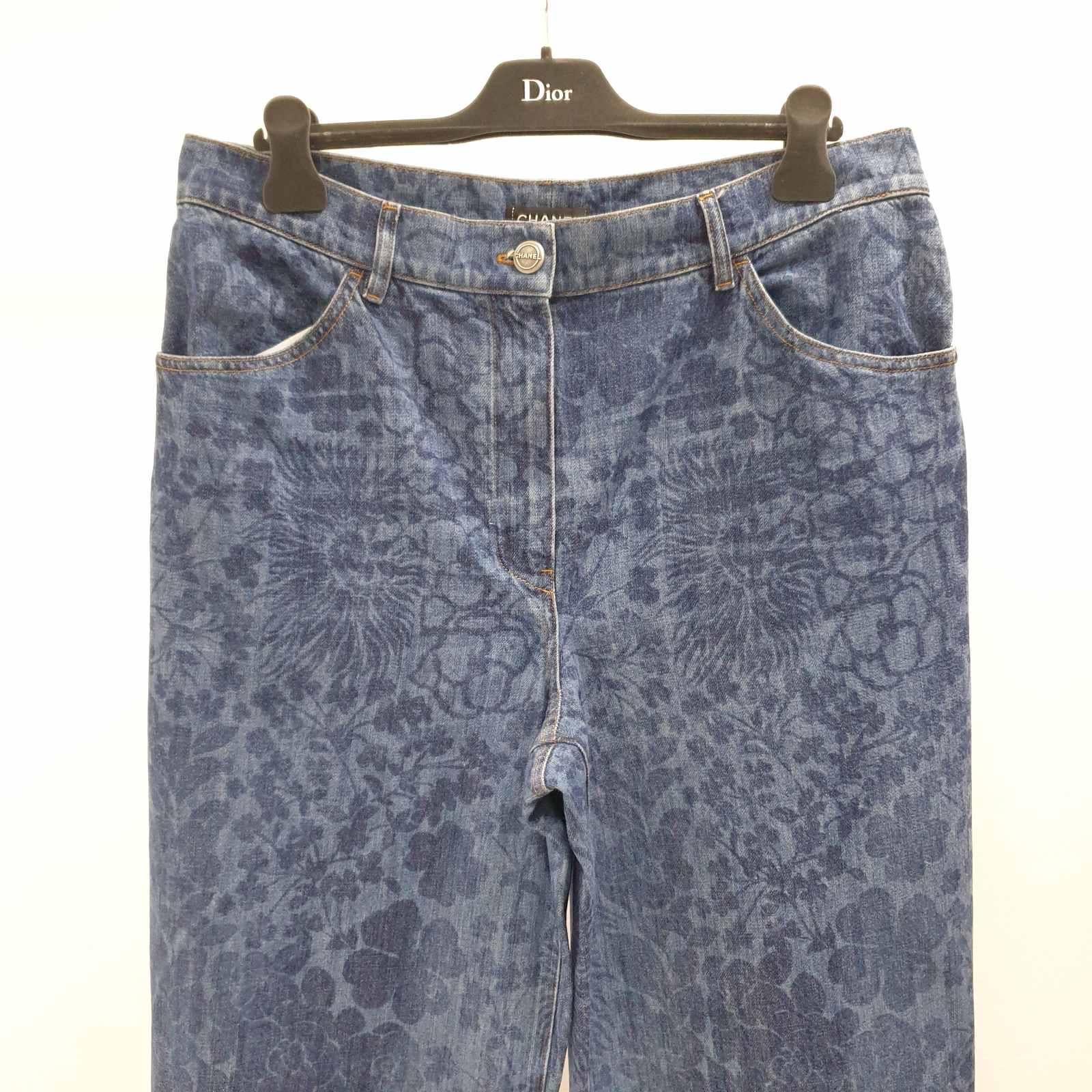 Look 81 From the Spring 2016 Runway. 
Medium wash blue Chanel high-rise wide-leg jeans with Camellia print throughout, four pockets, frayed trim at hem and hidden zip closure at center front. 
Sz.46
Very good condition