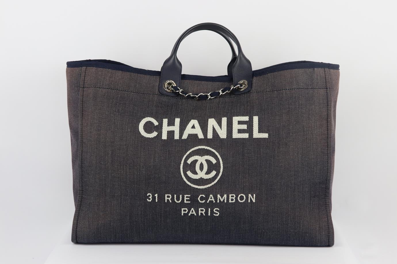 Chanel 2016 Deauville extra large canvas and leather tote bag. Made in Italy, this beautiful 2016 Chanel extra large ‘Deauville’ tote bag has been made from navy canvas exterior with matching interior, this piece is decorated with a bold ‘CHANEL’
