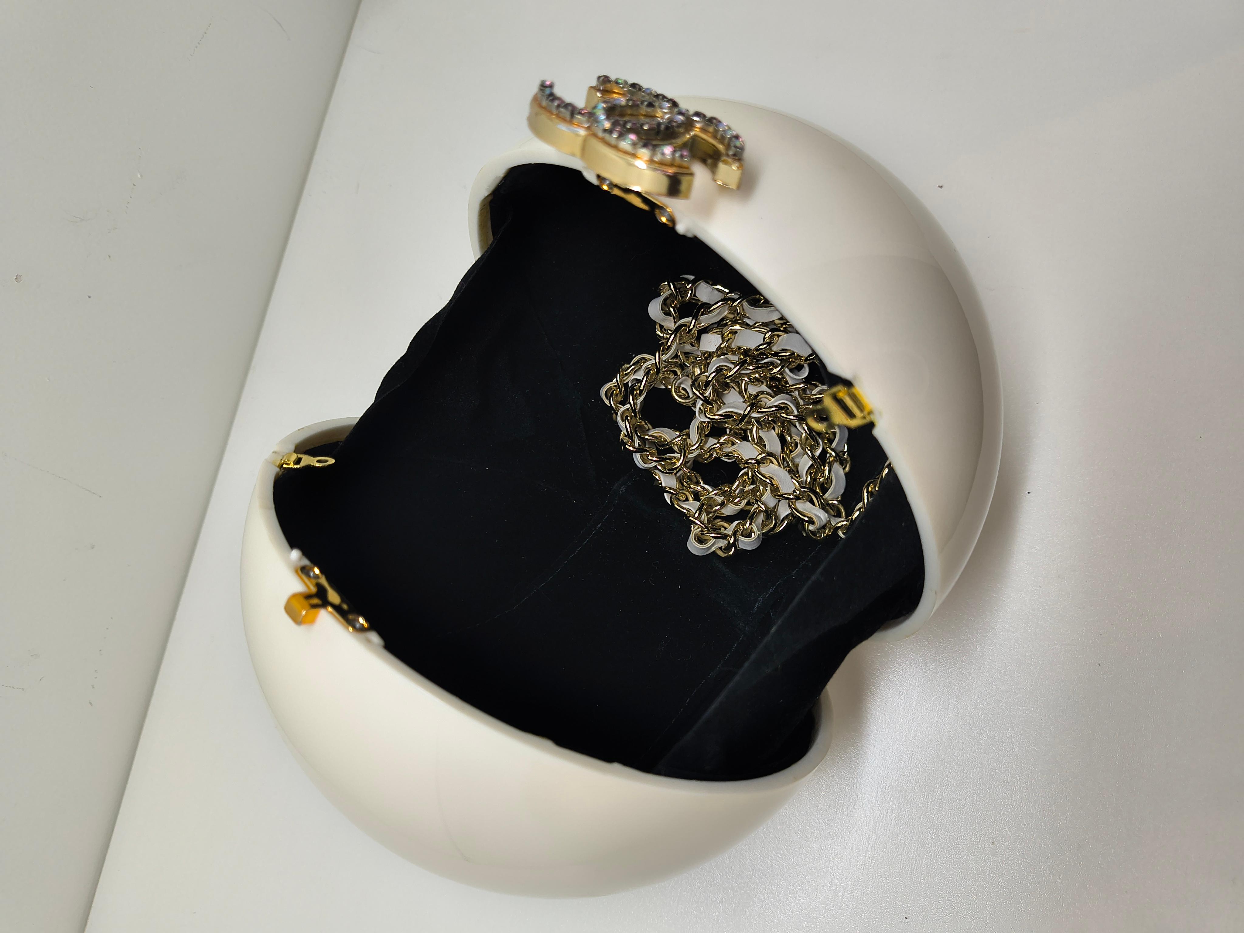 An ultra-rare collector’s piece from Chanel’s 2016 Cruise collection, inspired by the opulence and mystique of Dubai. This limited edition ball bag is a true objet d’art, showcasing Karl Lagerfeld’s signature flair for merging fantasy with