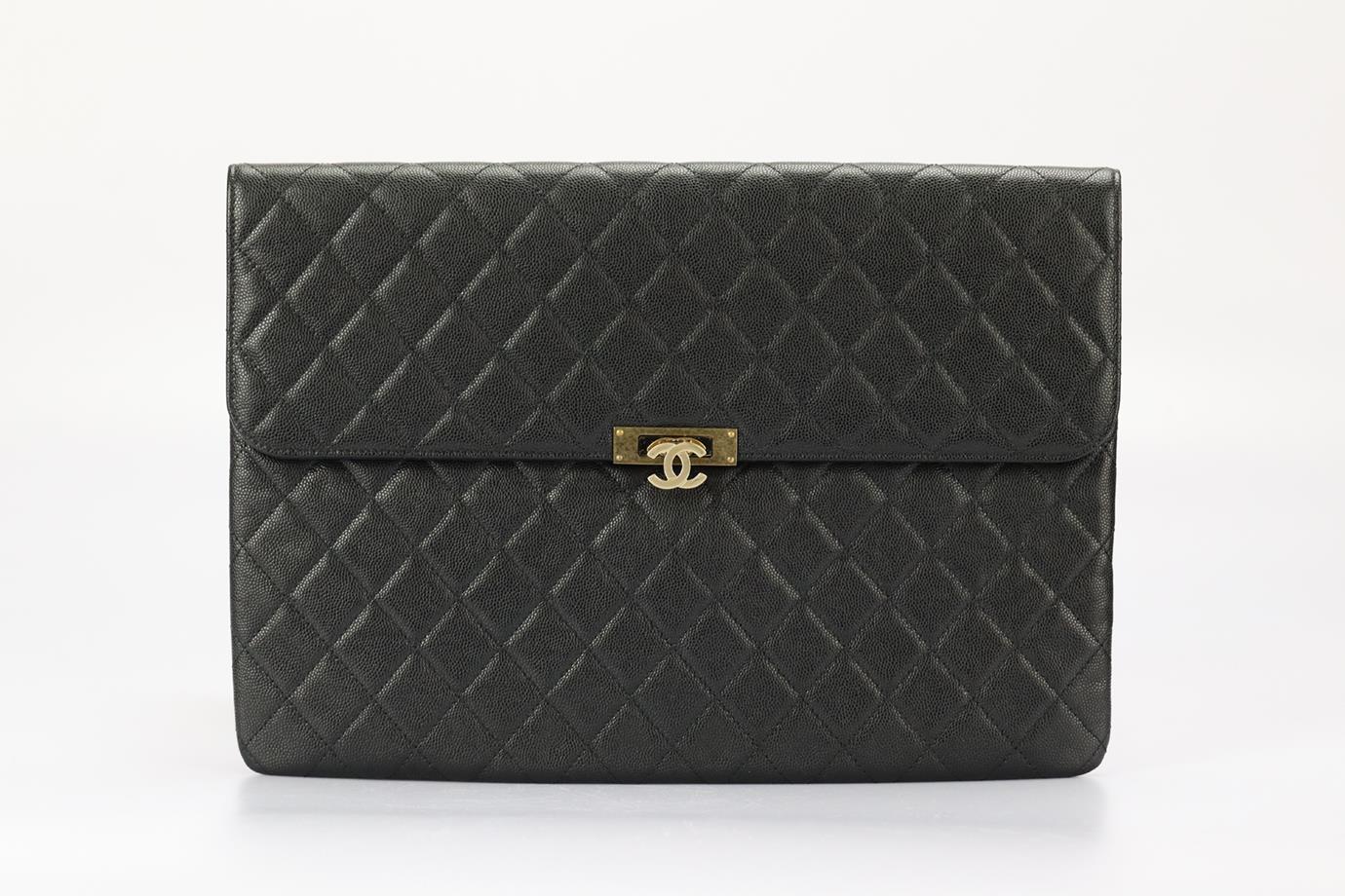 Chanel 2016 Golden Class O-case Large Quilted Caviar Leather Clutch. Black. Lock fastening - Front. Comes with - authenticity card. Does not come with - dustbag or box. Height: 9.3 in. Width: 13.6 in. Depth: 0.3 in. Condition: Used. Very good