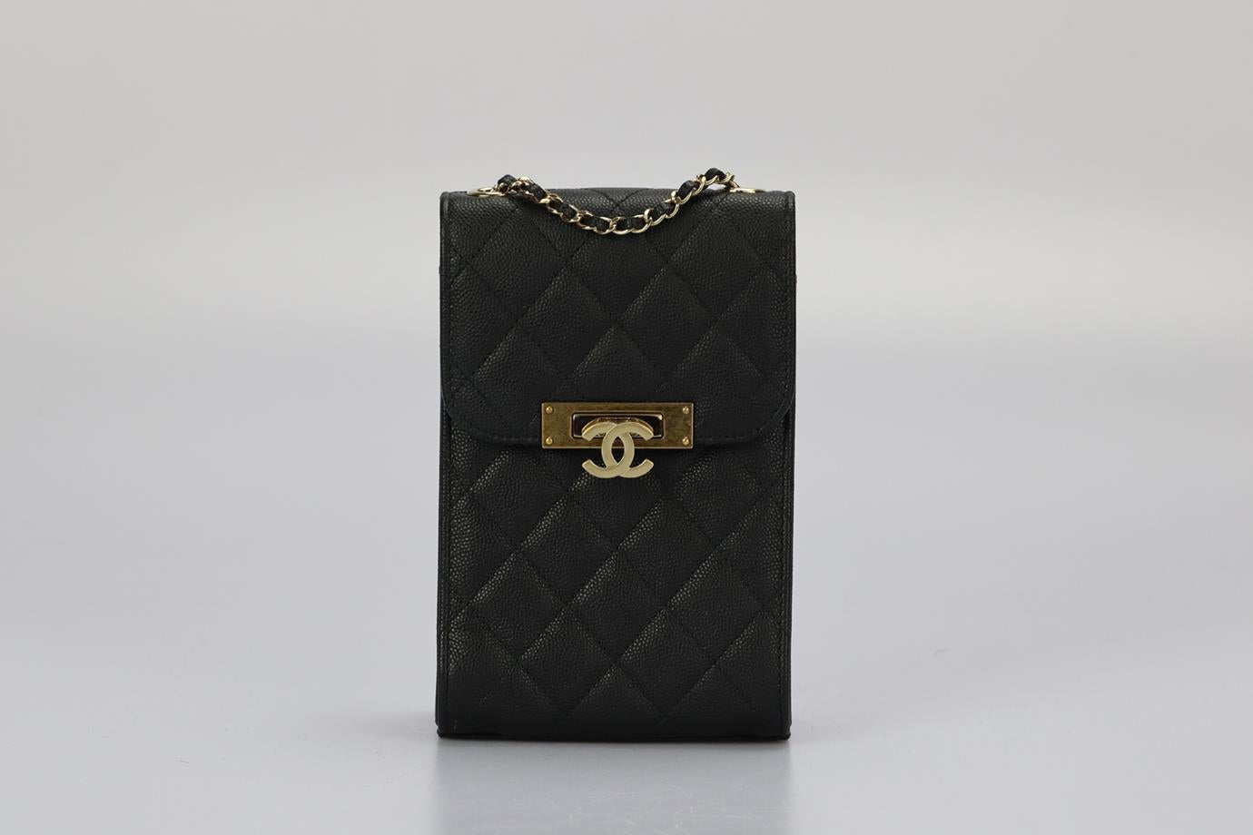Chanel 2016 Golden Class Phone Holder Quilted Caviar Leather Shoulder Bag. Black. Lock fastening - Front. Comes with - authenticity card. Does not come with - dustbag or box. Height: 6.8 in. Width: 4.4 in. Depth: 2.6 in. Strap drop: 22.5 in.