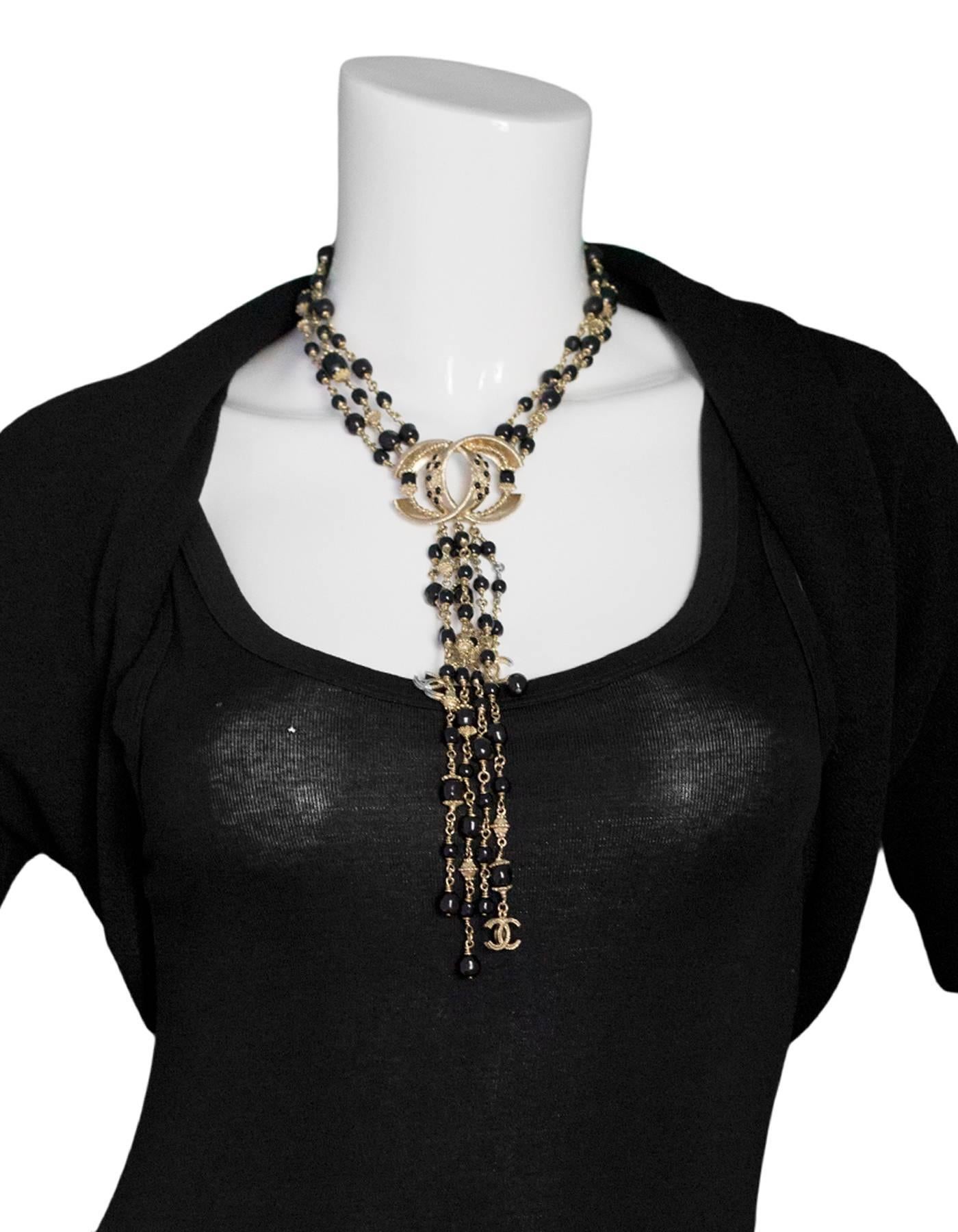 Chanel Goldtone & Black Beaded Multi-Strand CC Necklace

Made In: Italy
Year of Production: 2016
Color: Gold, black
Materials: Metal, beads
Stamp: Chanel B16 CC A Made in Italy
Closure: Lobster claw closure
Overall Condition: Excellent pre-owned