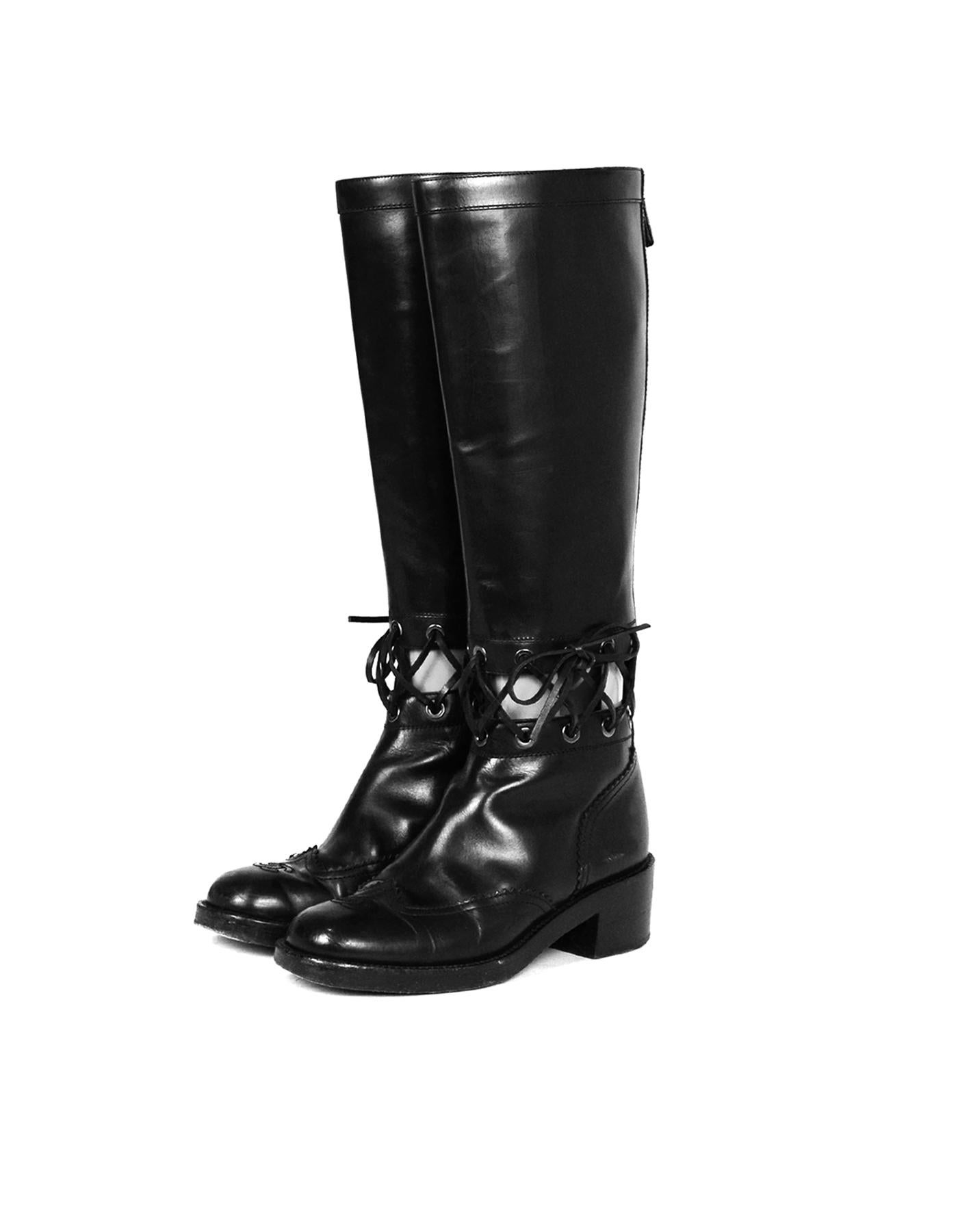 Chanel Black Leather Boots with Lace Cut Out sz 38.5

Made In: Italy 
Color: Black
Hardware: Silvertone
Materials: Leather
Closure/Opening: Back Zip
Overall Condition: Good pre-owned condition, marks and scuffs on the back of the heel, wear on the