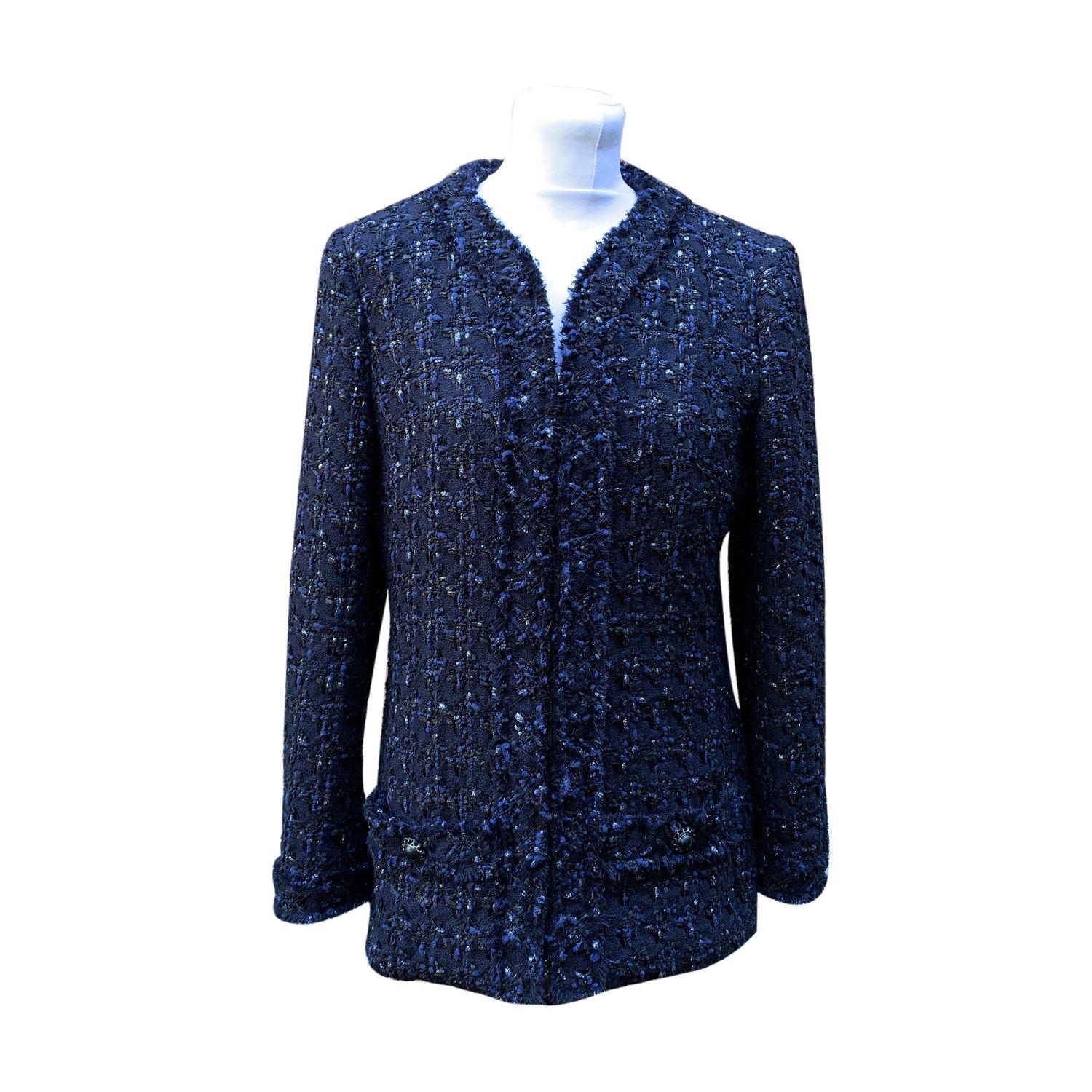 Chanel jacket from the 2016 Collection. Blue, black and silver bouclé pattern. Concealed zip closure on the front. 2 pockets on the front. Signature chain along the hem. Made in France. Composition: 40% Wool, 36% Nylon, 6% Polyester, 6%