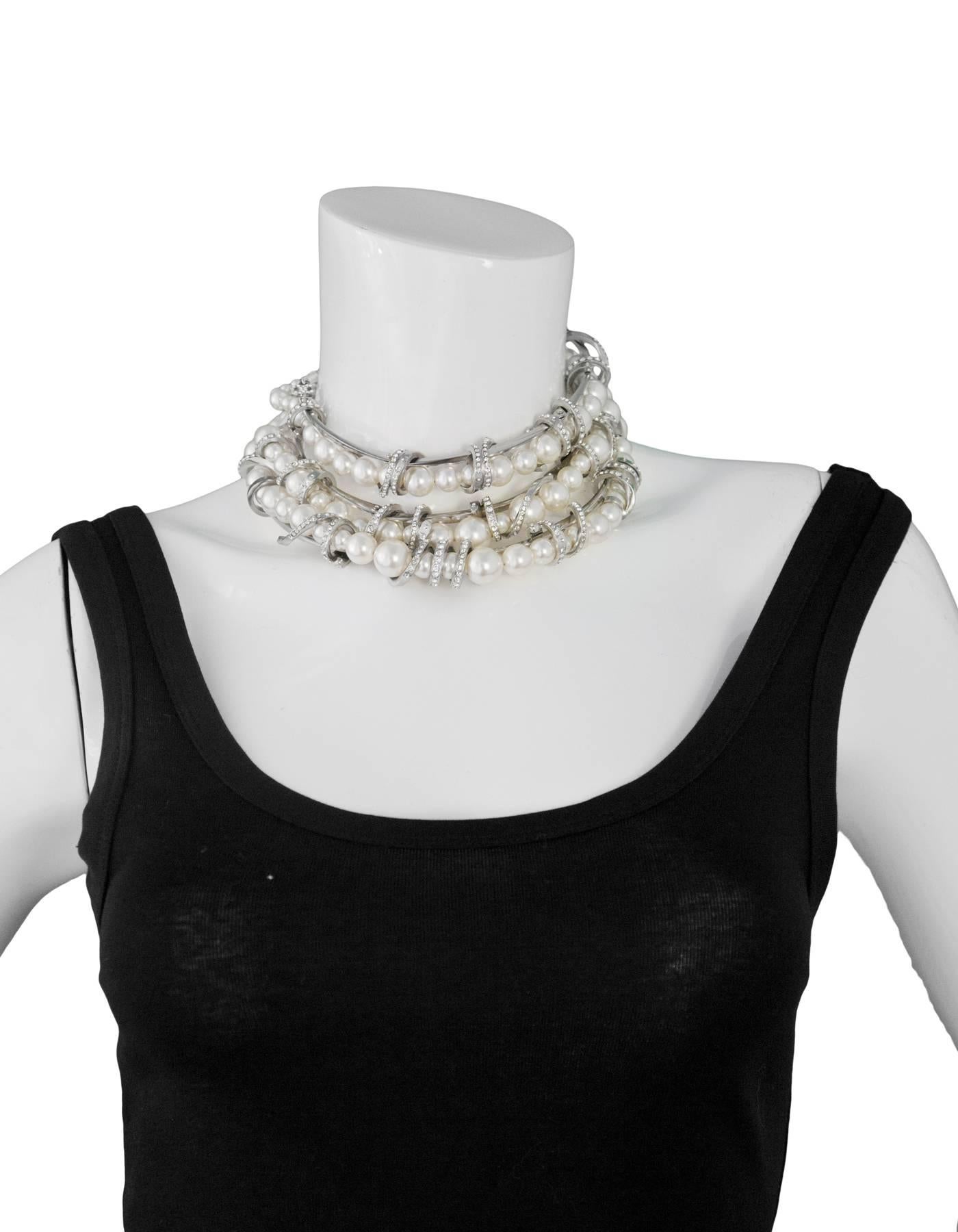 Chanel Three-Strand Graduated Pearl & Crystal Coil Choker
Features pave crystal metal coils

Made In: France
Year Of Production: 2016
Color: Ivory, silver
Materials: Faux pearl, metal, crystal
Closure: Lobster claw closure
Stamp: Chanel 16 CC S Made