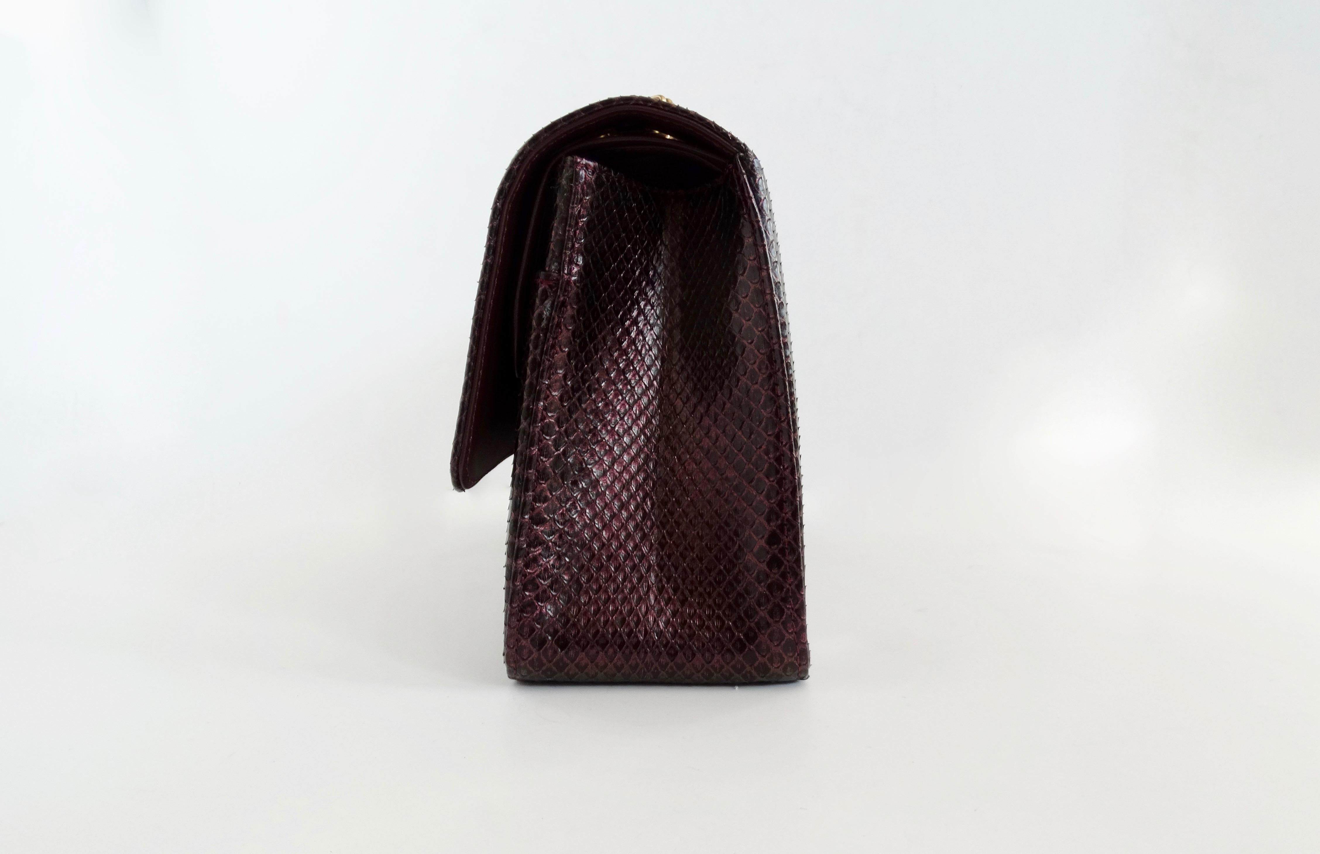 Snag yourself a rare Chanel! Circa 2017/2018, this double flap Chanel is crafted from python and finished in a gorgeous iridescent deep purple. Features an antiqued gold Mademoiselle turn lock closure, a double or single chain link shoulder strap