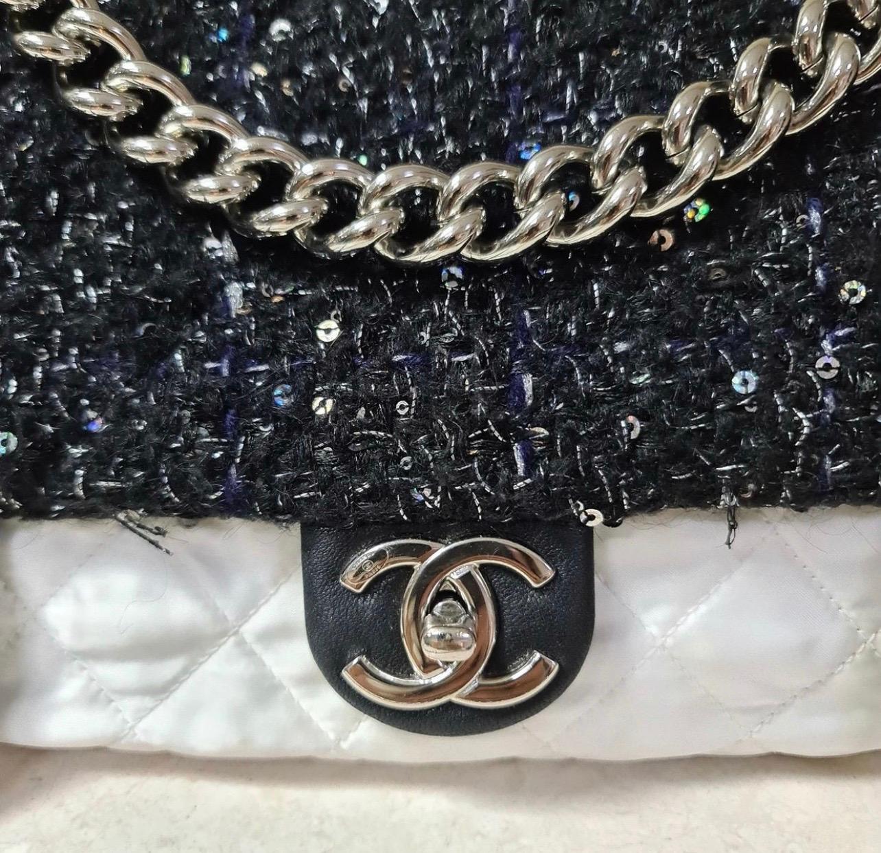From the Winter 2017 Collection.

White nylon Chanel Tweed Flap Bag with silver-tone hardware, single chain-link shoulder strap, tweed shoulder guard, single chain-link handle, multicolor tweed trim at flap, single exterior zip pocket, black