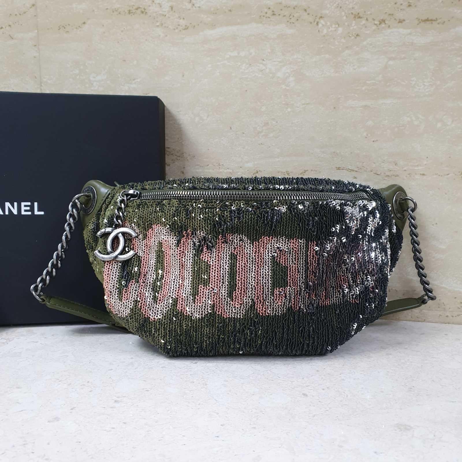 From the 2017 Cruise Cuba Collection.
 Olive green quilted leather Chanel waist bag with antique silver-tone hardware, adjustable waist strap, multicolor sequin accents at front, exterior zip pocket at back, tonal satin lining, single slip pocket at