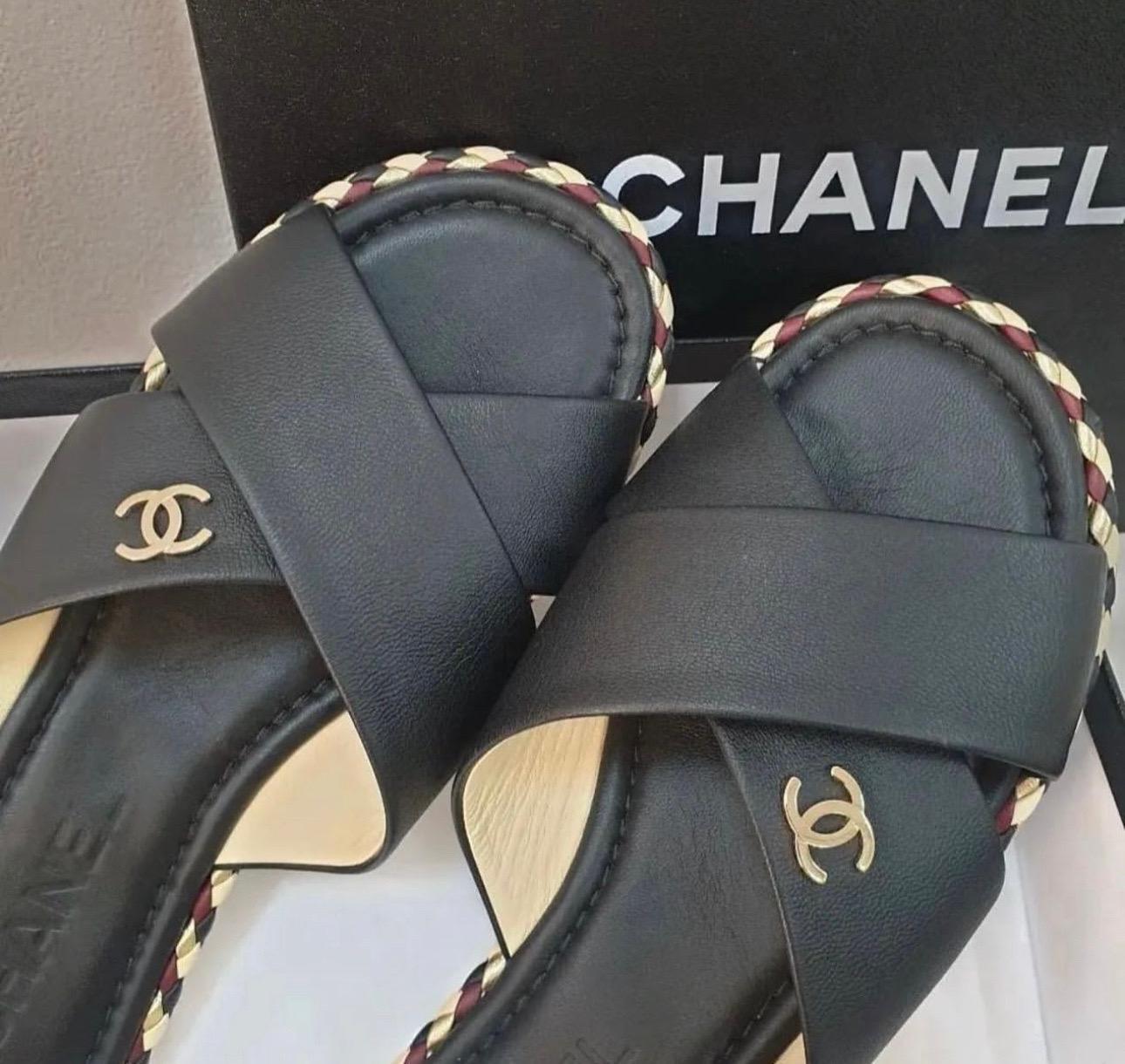     Chanel Leather Slides
    From the 2017 Collection by Karl Lagerfeld
    Black
    Interlocking CC Logo
    Braided Accents
    Block Heels
    Crossover Straps
Sz.38
Very good condition.
No box. No dust bag.
