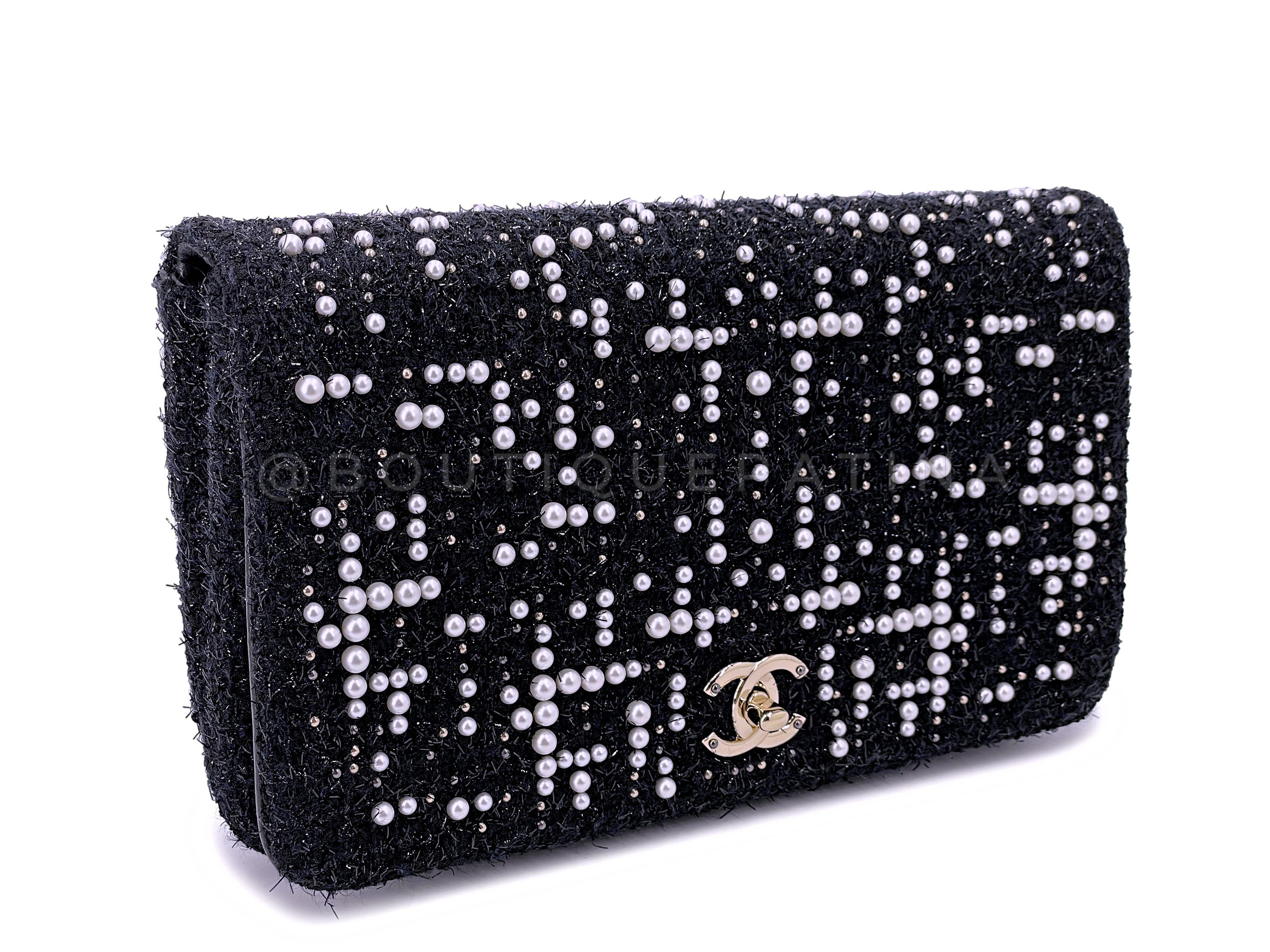 Store item: 67167
Unique to the 2017 Paris Cosmopolite collection is this very special pearl and fantasy tweed clutch. 

A substantial size at nearly 11 inches wide, with a back pocket for phone and turnlock front CC clasp opens to two main
