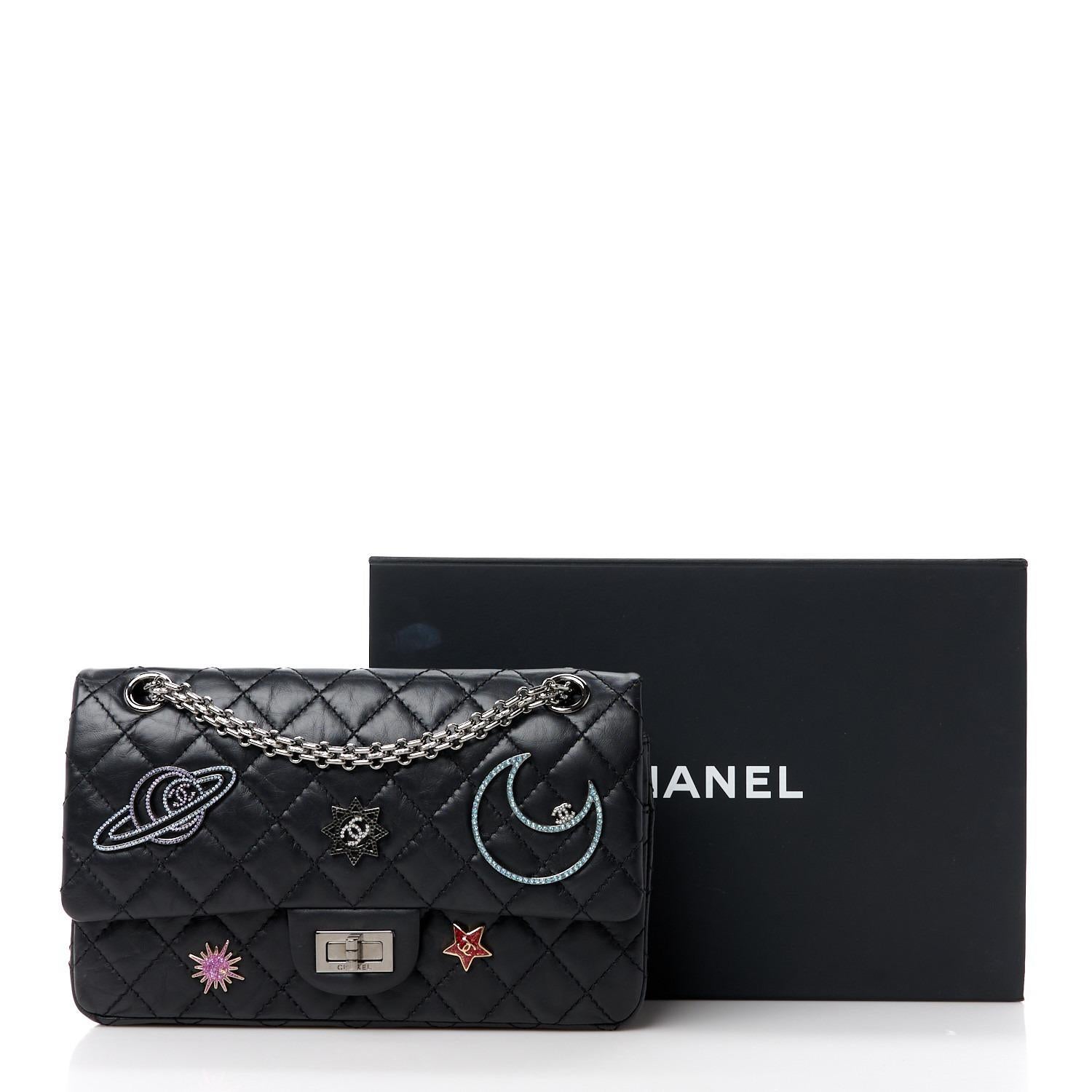Quilted Chanel 226 reissue black lambskin space charm flap with mademoiselle closure and reissue chain

Year: 2017
Silver hardware
Space astronomy inspired charms
Interior flap zippered pocket
Interior flap
Interior open pockets
Classic back