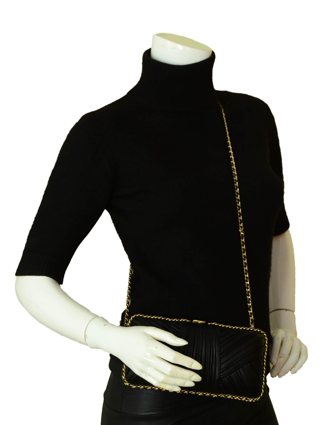 Chanel 2018 Black Pleated Chain Around Clutch Bag w/ Crossbody Strap

Made In: Italy
Year of Production: 2018
Color: Black
Hardware: Goldtone
Materials: Smooth pleated leather
Lining: Smooth leather
Closure/Opening: Frame
Exterior Pockets: