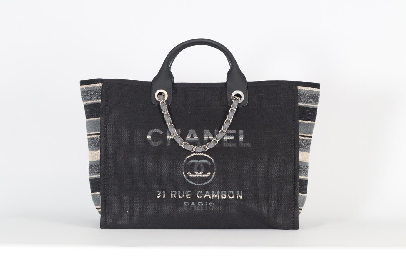 <ul>
<li>Chanel 2018 Deauville Medium Canvas And Leather Tote Bag.</li>
<li>Grey, black, cream and blue.</li>
<li>Magnetic fastening - Top.</li>
<li>Comes with Authenticity Card.</li>
<li>Does not come with - dustbag or box.</li>
<li><strong>Model: