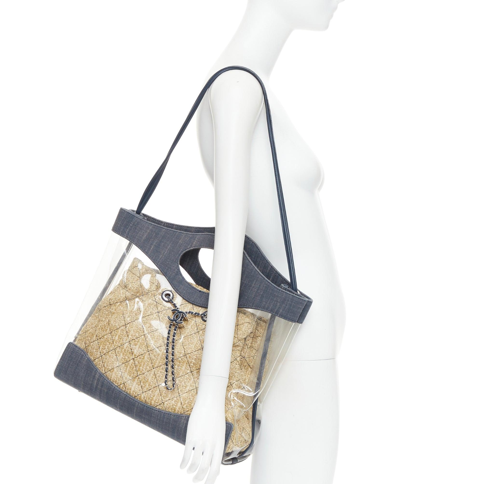 CHANEL 2019 31 clear PVC denim trim beige raffia lined tote bag
Reference: JACG/A00261
Brand: Chanel
Designer: Karl Lagerfeld
Model: 31
Collection: Fall Winter 2018
Material: Denim, PVC
Color: Blue, Clear
Pattern: Solid
Closure: Drawstring
Lining: