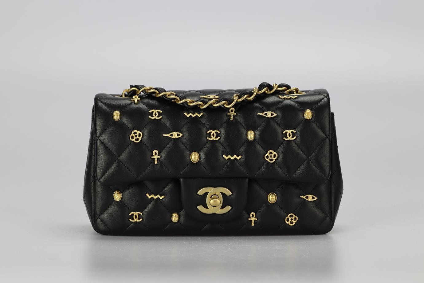 Chanel 2019 Classic Mini Rectangle Flap Egyptian Amulet Quilted Leather Shoulder Bag. Black. Twist lock fastening - Front. Comes with - authenticity card. Does not come with - dustbag or box. Height: 4.5 in. Width: 7.8 in. Depth: 2.4 in. Strap drop: