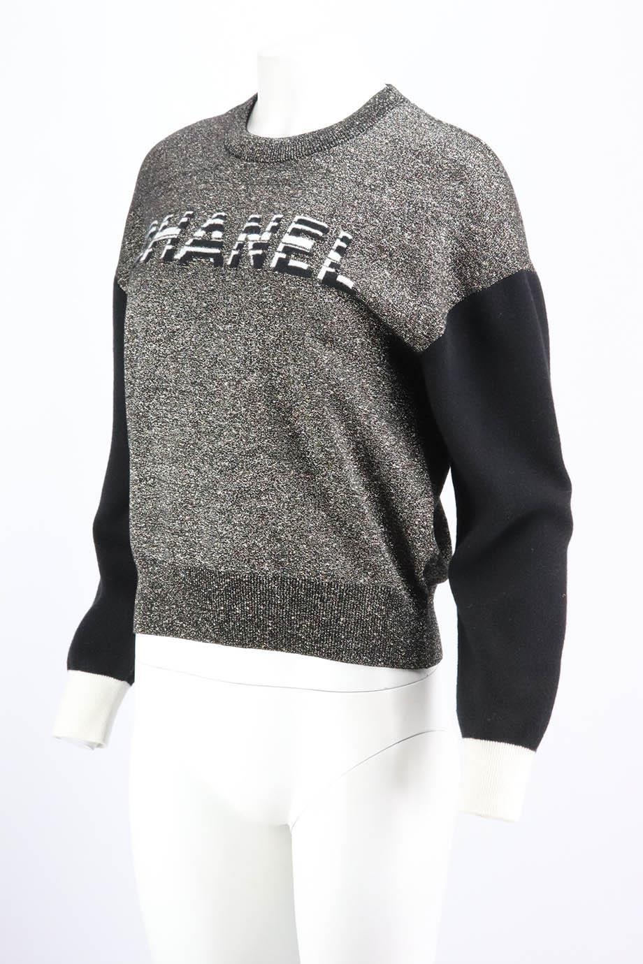 This sweater by Chanel from the brand’s 2019 collection is intarsia-knitted with the house's moniker across the chest, it’s spun from soft cashmere-blend sleeves with metallic body, it has a relaxed fit tempered by ribbed trims. Gold, silver, black