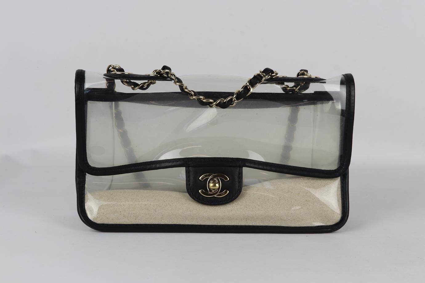 Chanel Black 2019 Sand By The Sea PVC and Leather Single Flap Shoulder Bag. Made from clear PVC and black leather trim with matching interior and antiqued silver-tone hardware and chain shoulder straps. Black. Twist lock fastening front. Does not