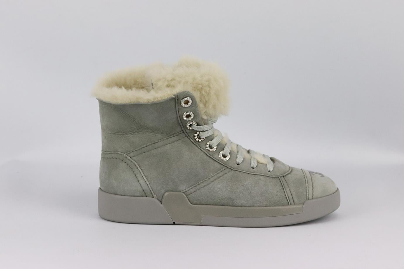 Chanel 2019 shearling lined suede sneakers. Grey. Lace up fastening at front. Does not come with box or dustbag. Size: EU 38 (UK 5, US 8). Outersole: 10.3 in. Shaft: 4.1 in. Heel: 1.2 in. New without box
