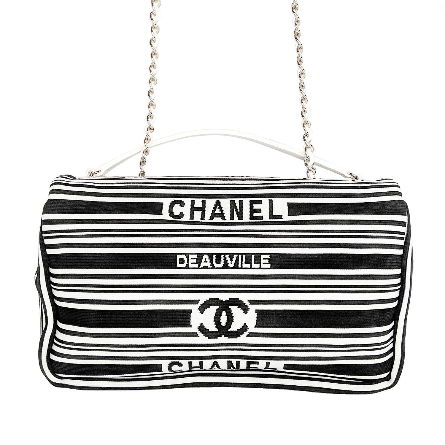 From the 2019 Collection. White and black striped woven Chanel Venise Biarritz bag with silver-tone hardware, white leather trim, chain-link and leather shoulder strap with shoulder pad, logo accents at exterior, tonal leather and textile lining,