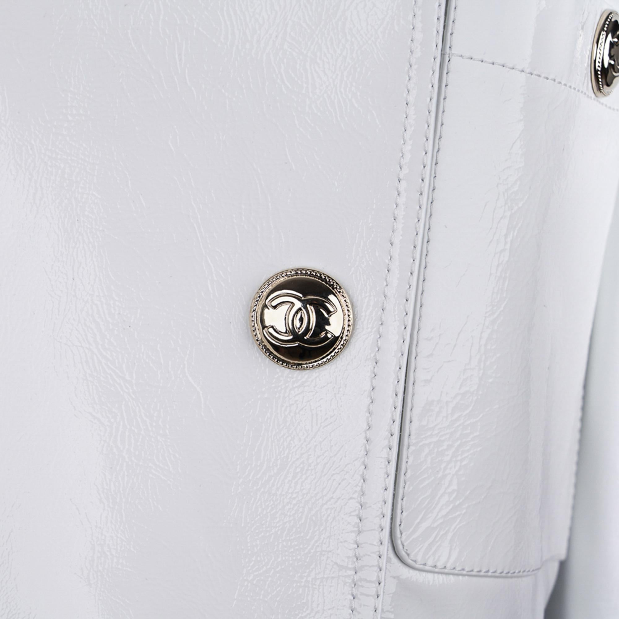 Mightychic offers a rare Chanel 2020-21FW White patent leather jacket.
Absolutely fabulous!
Short biker waist length jacket with stand up collar.
Bold silver hardware with CC center.
4 Silver asymmetrical CC snap buttons.
2 Patch breast pockets with