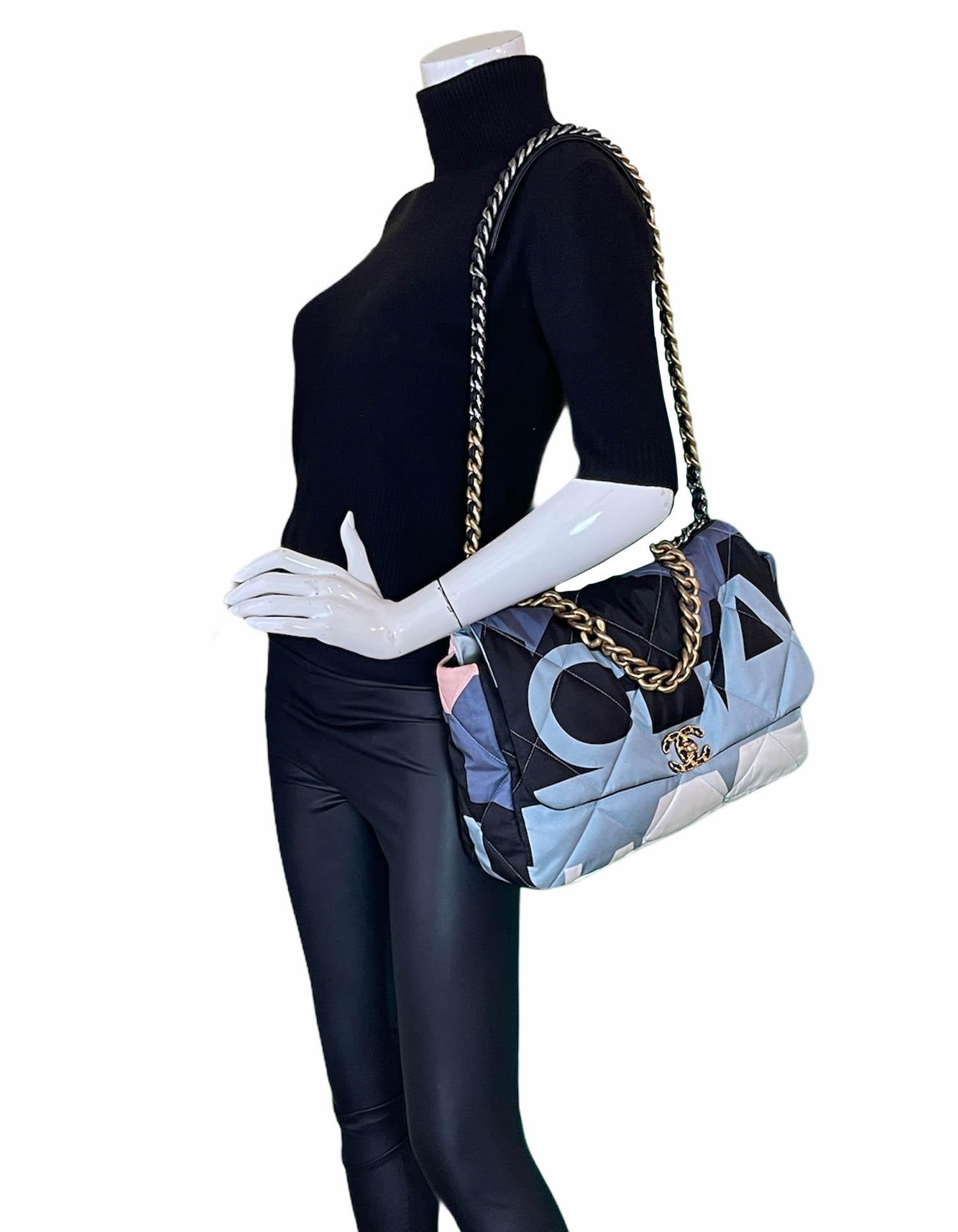 Chanel Blue/White/Black Nylon Maxi Scarf Chanel 19 Flap Bag

Made In: Italy
Year of Production: 2020
Color: Blue, white, black, pink
Hardware: Goldtone, silvertone, ruthenium 
Materials: Fabric, metal, leather
Lining: Pink grosgrain
Closure/Opening: