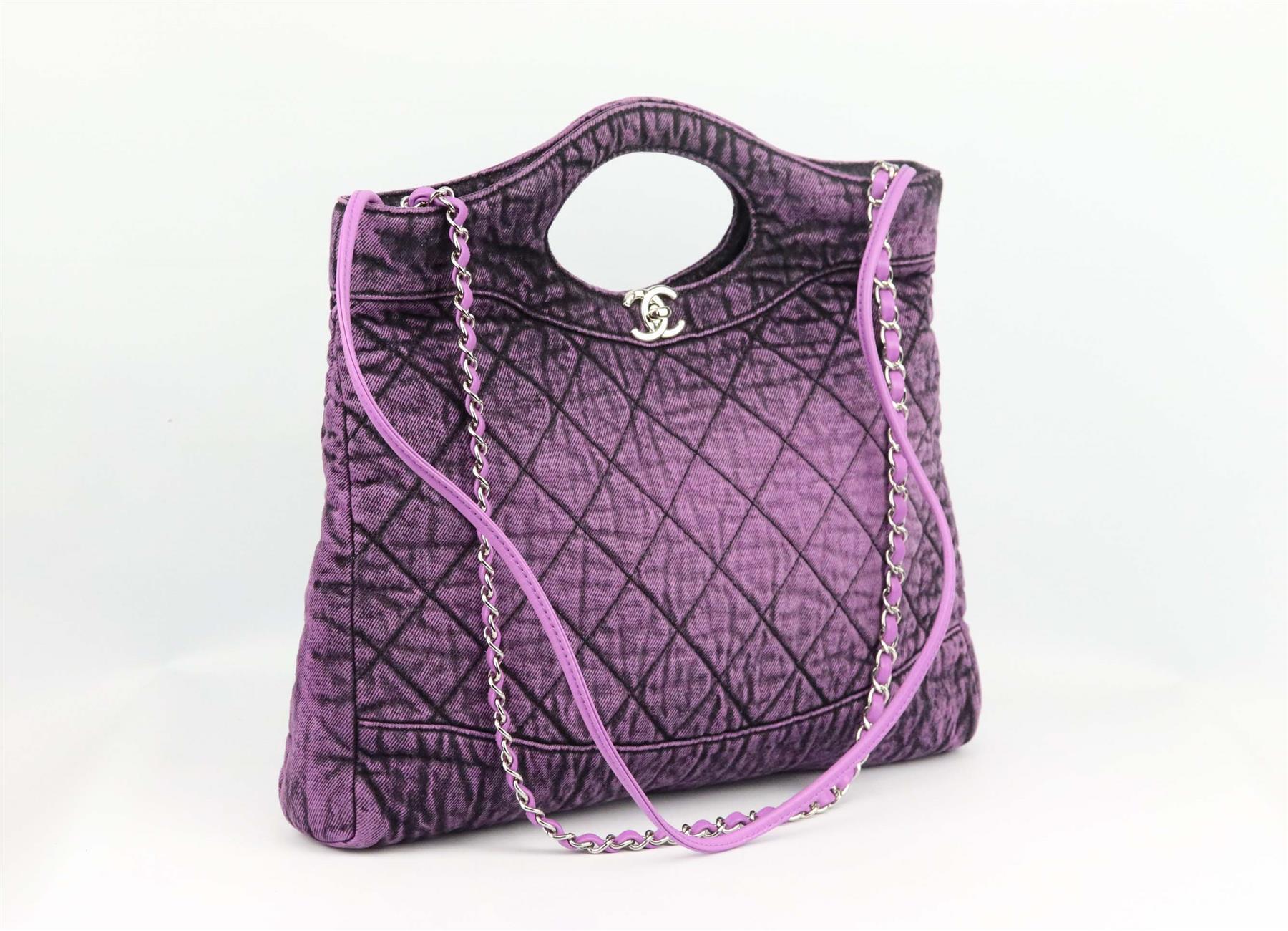 Made in Italy, this beautiful 2020 Chanel ‘Denimpression’ tote bag has been made from quilted washed-denim and soft purple calfskin leather exterior, this piece is decorated with a logo CC detail on the front and finished with silver-tone chain and