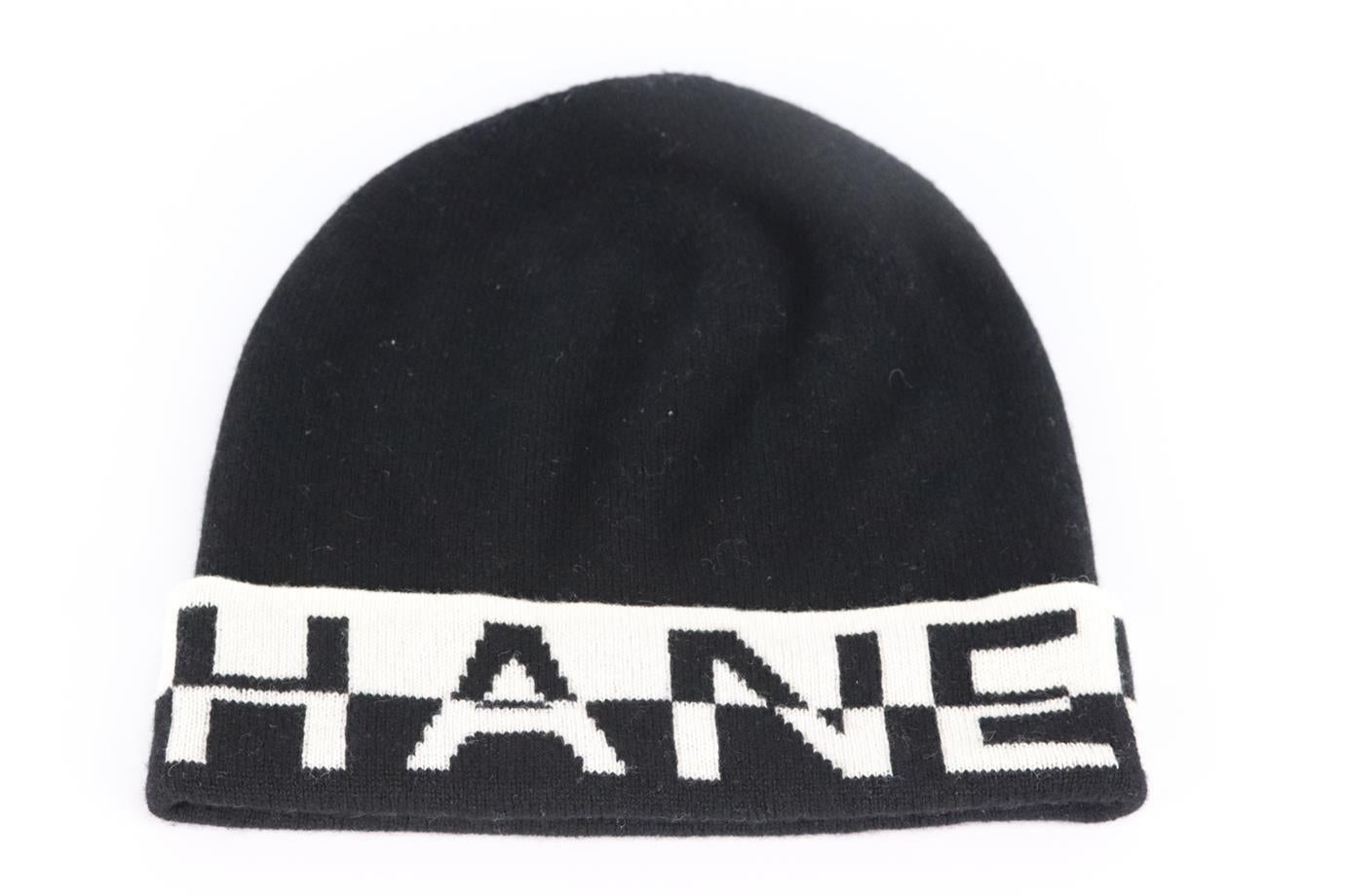 Chanel 2020 logo intarsia cashmere beanie. Black and white. Slips on. 100% Cashmere. Does not come with dustbag or box. Length: 9.5 in. Circumference: 18.8 in. Very good condition - No sign of wear; see pictures.