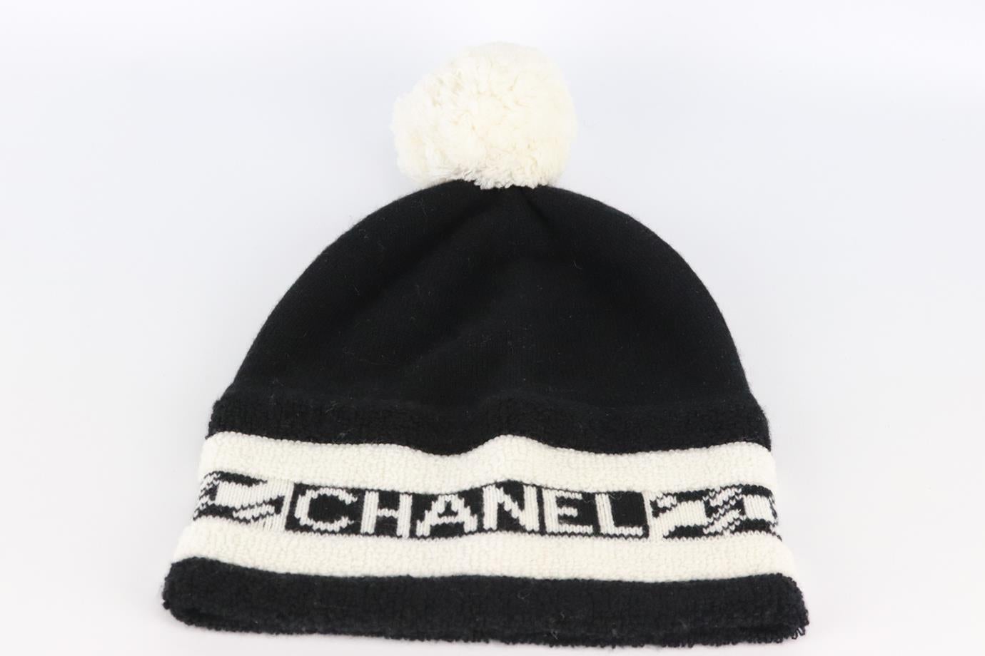 Chanel 2020 logo intarsia cashmere beanie. Black and white. Slips on. 100% Cashmere. Does not come with dustbag or box. Length: 10.5 in. Circumference: 20 in. Very good condition - No sign of wear; see pictures.