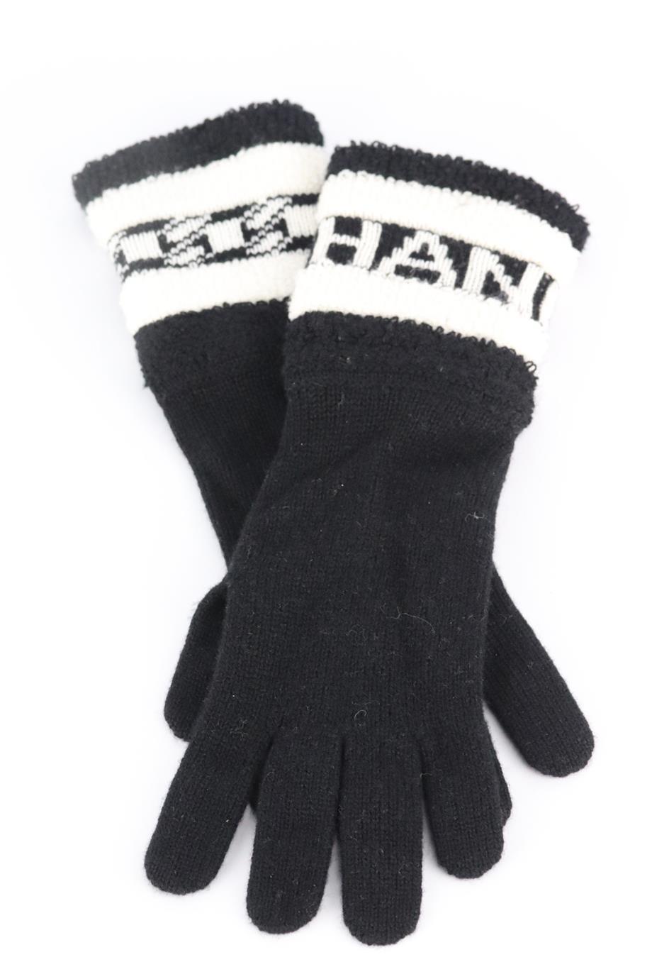 Chanel 2020 logo intarsia cashmere gloves. Black and white. Pull on. 100% Cashmere. Does not come with dustbag and box. Length: 12.5 in. Width: 3.5 in. Very good condition - No sign of wear; see pictures.