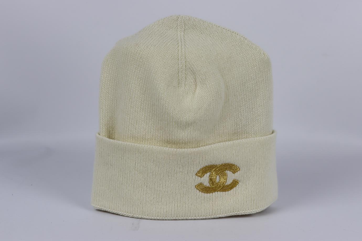 Chanel 2021 cc embroidered cashmere beanie. Cream and gold. Slips on. 100% Cashmere. Does not come with dustbag or box. Size: One Size. Circumference: 17.6 in. Very good condition - No sign of wear; see pictures.
