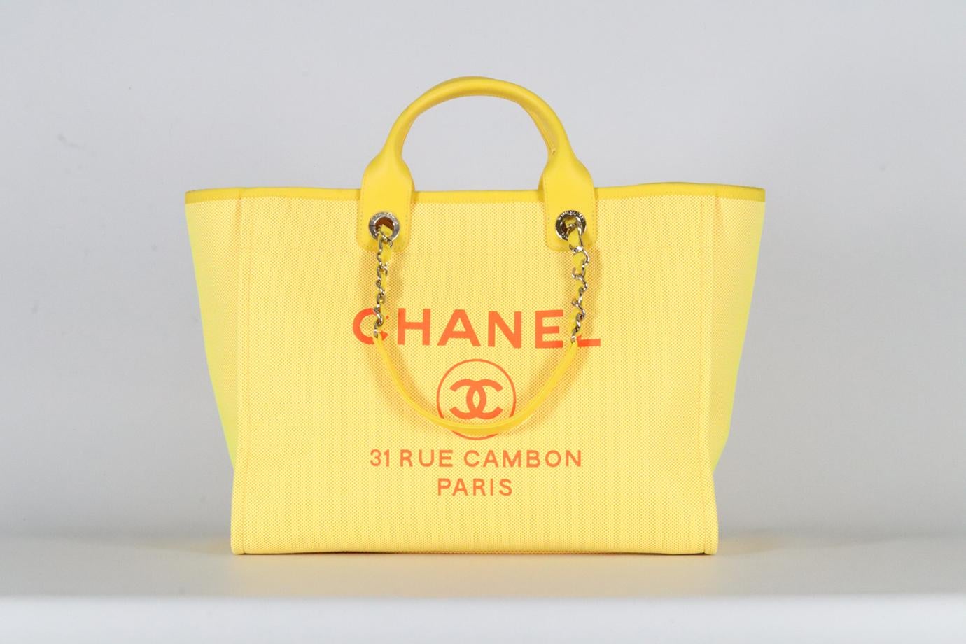 <ul>
<li>Chanel 2021 Deauville Medium Mix Fibers And Leather Tote Bag.</li>
<li>Neon-yellow and orange.</li>
<li>Magnetic fastening - Top.</li>
<li>Comes with Authenticity Card.</li>
<li>Does not come with - dustbag or box.</li>
<li><strong>Model: