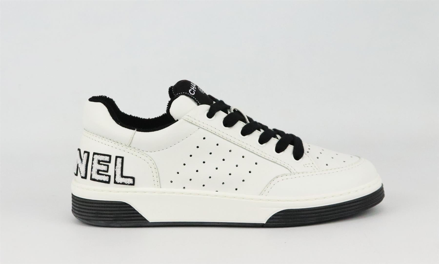 Part of Chanel's 2021 Collection, these low-top sneakers have been made from durable calfskin leather, they have the brand's logo on the back in leather and terry cloth and finished with thick black laces and terry-cloth interior to make it easy to