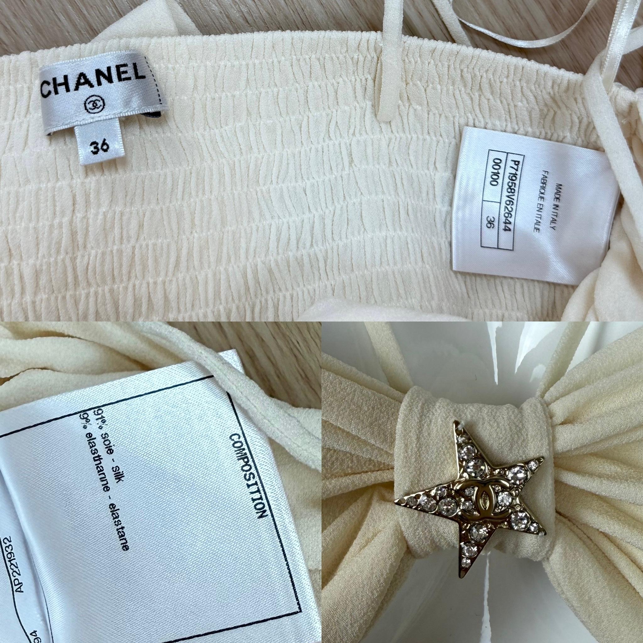 Chanel
Croisière 2021/22
Style du défilé
Soie beige
Étoiles argentées avec cristaux clairs
Pullover
Attaches réglables
FR36
Excellent état, aucun défaut
Dimensions en pouces à plat : d'une fosse à l'autre 12 à 16

Vente finale