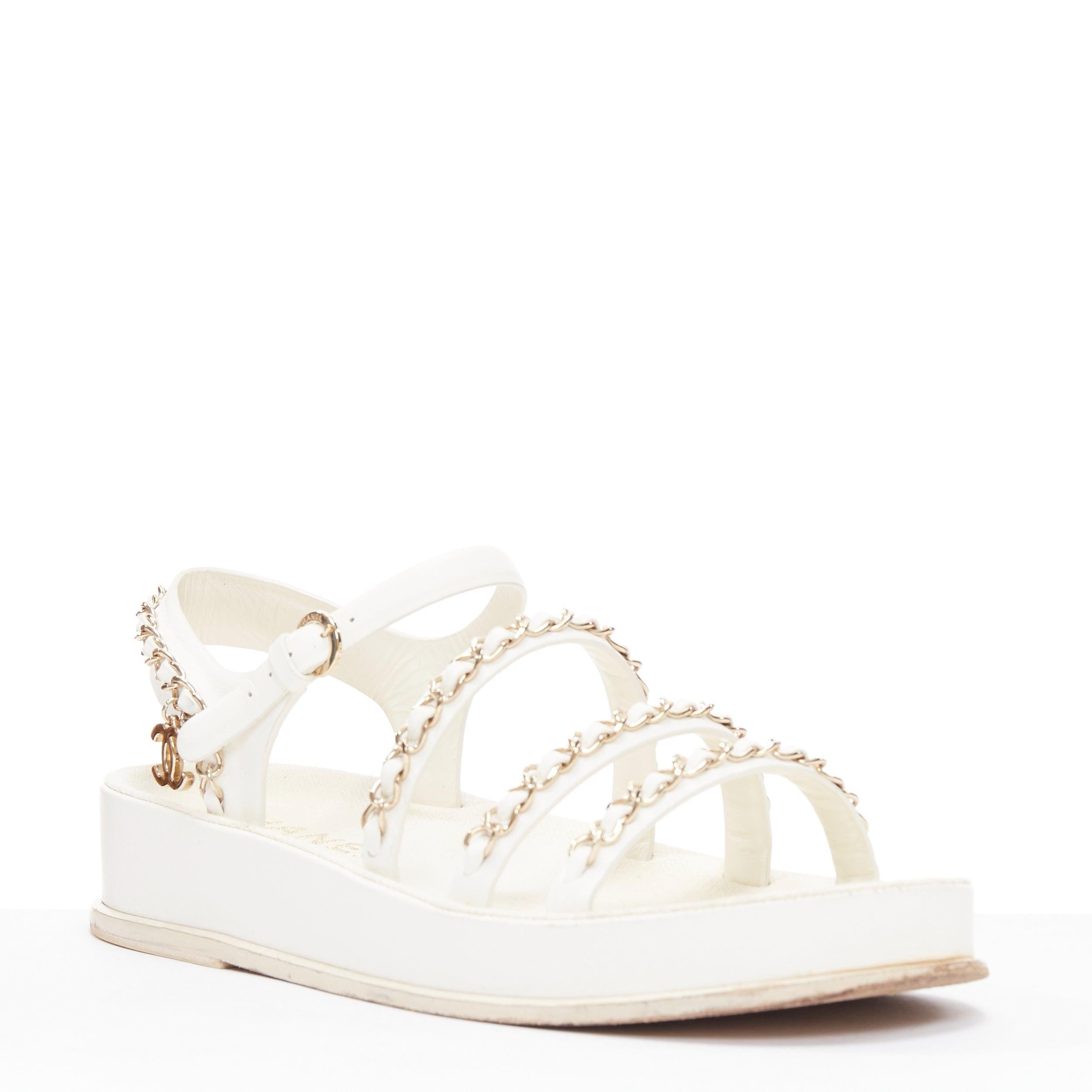 CHANEL 2021 white calfskin gold chain platform CC logo dad sandals EU36
Reference: EALU/A00051
Brand: Chanel
Collection: 2021
Material: Leather, Metal
Color: White, Gold
Pattern: Solid
Closure: Belt
Lining: White Fabric
Extra Details: Calfskin Chain