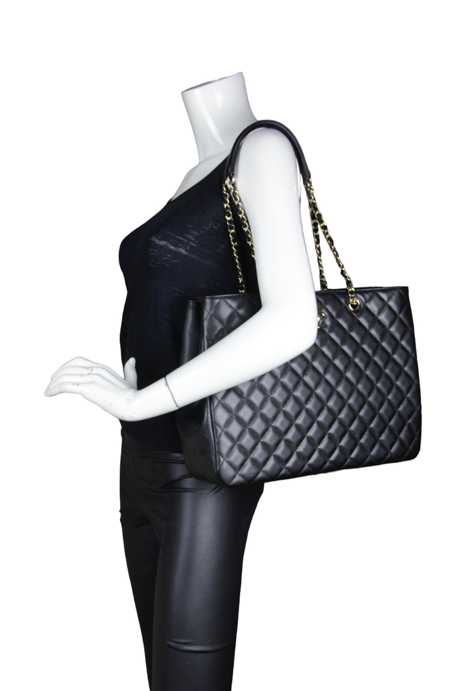 Chanel Black Caviar Quilted Large Classic Shopping Tote Bag 

Made In: Italy
Year of Production: 2022
Color: Black
Hardware: Pale goldtone
Materials: Caviar leather
Lining: Black leather
Closure/Opening: Open top with center twist-lock