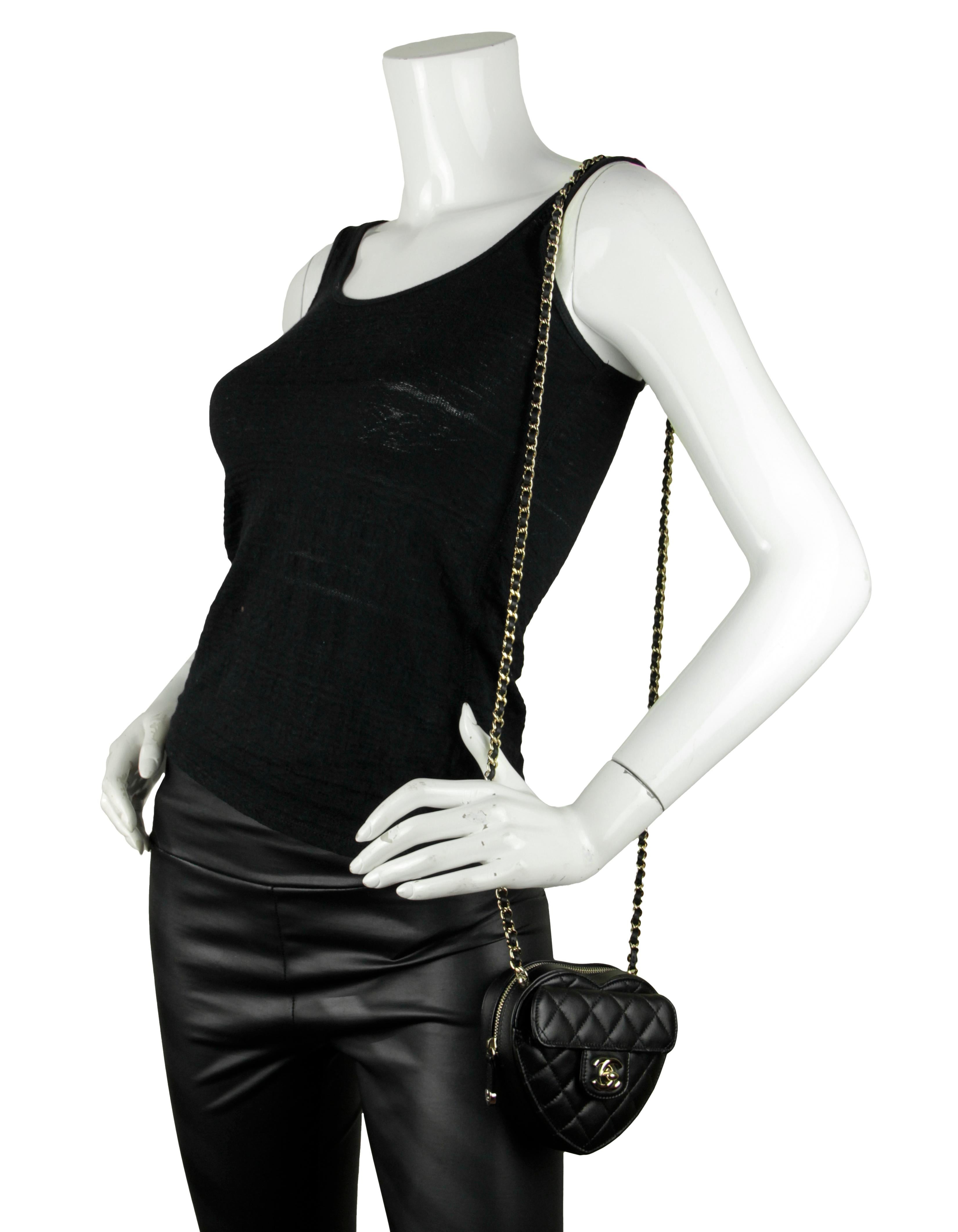 Chanel Black Lambskin Quilted CC In Love Heart Clutch Bag With Chain

Made In: France 
Year of Production: 2022
Color: Black
Hardware:Goldtone
Materials: Lambskin leather
Lining: Burgundy grosgrain
Closure/Opening: Zip
Exterior Pockets: Front