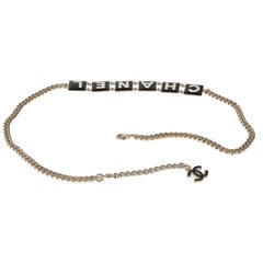 Chanel 2022 Black & White Enamel Gold Plated Logo Belt
